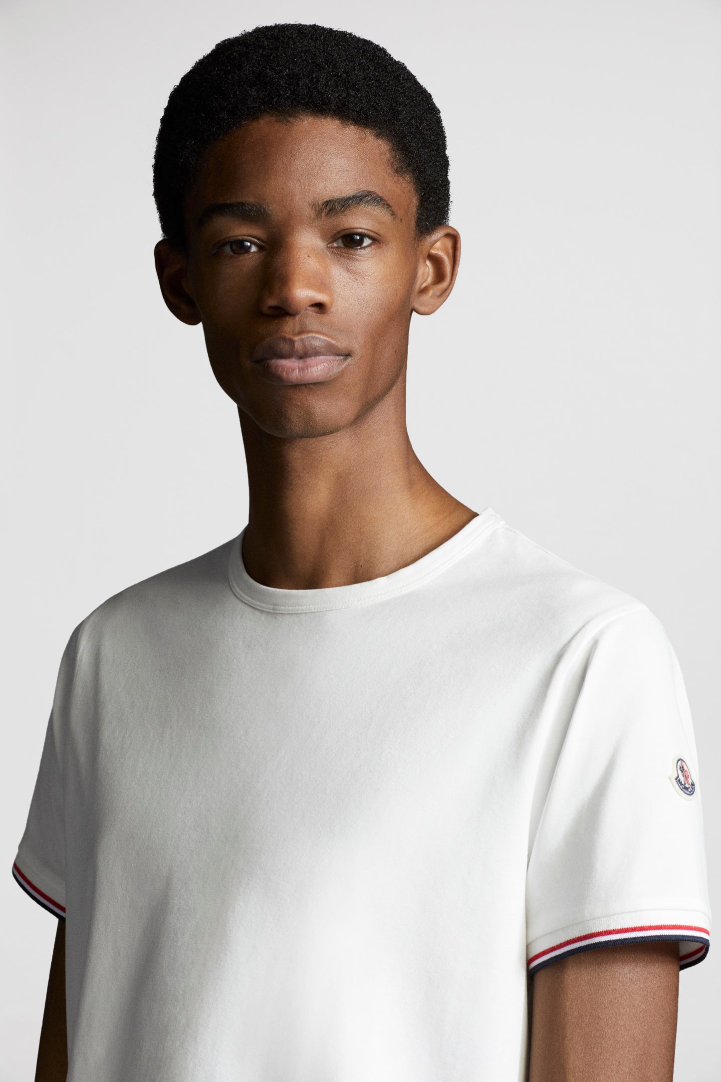 Moncler T-shirt, White logo T-shirt, Luxury trim T-shirt, High-end fashion T-shirt, Designer casual wear