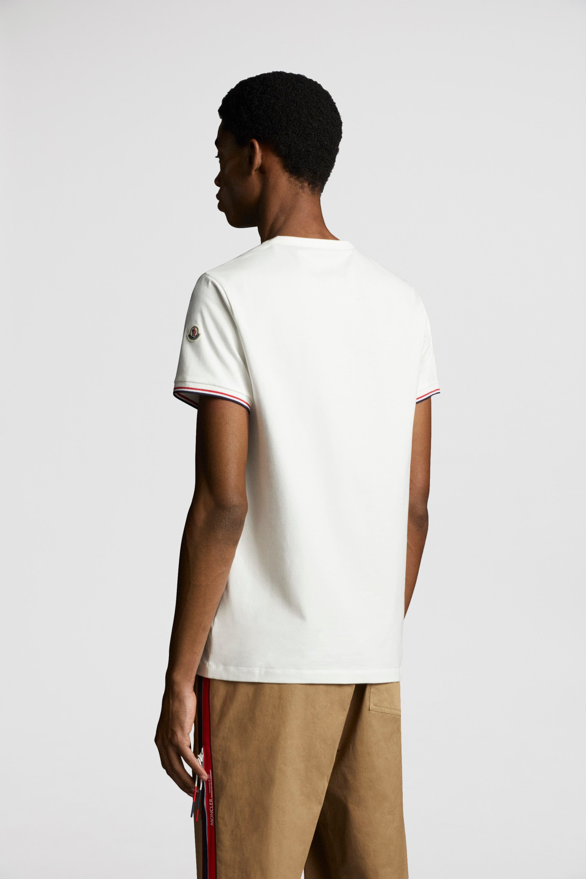 Moncler T-shirt, White logo T-shirt, Luxury trim T-shirt, High-end fashion T-shirt, Designer casual wear