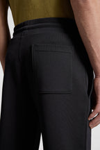 luxury jogging pants, black jogging pants, Moncler heart logo, designer casual wear, high-end fashion pants