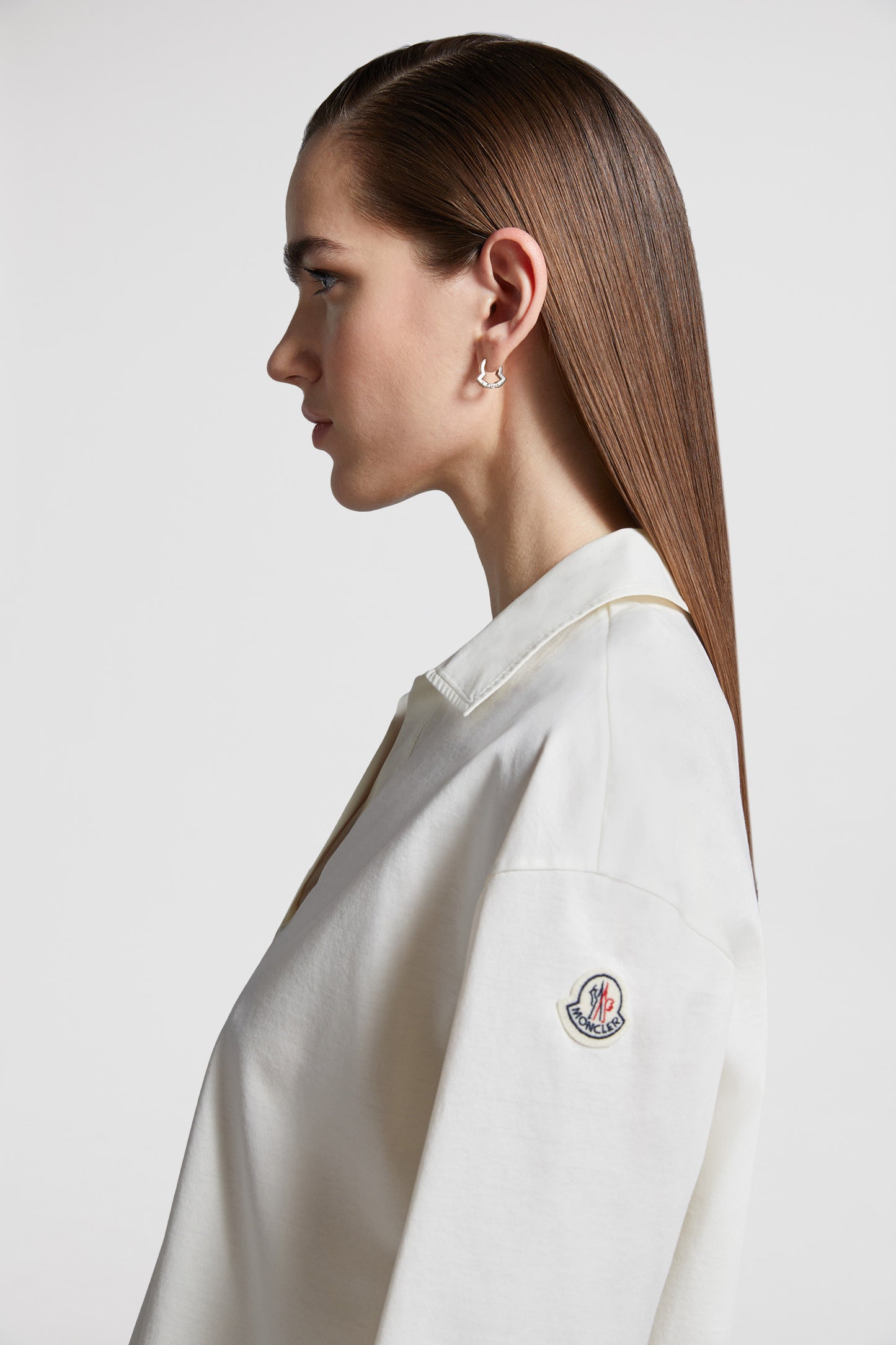 Moncler polo shirt, luxury casual polo, classic white polo, high-end fashion, refined elegance