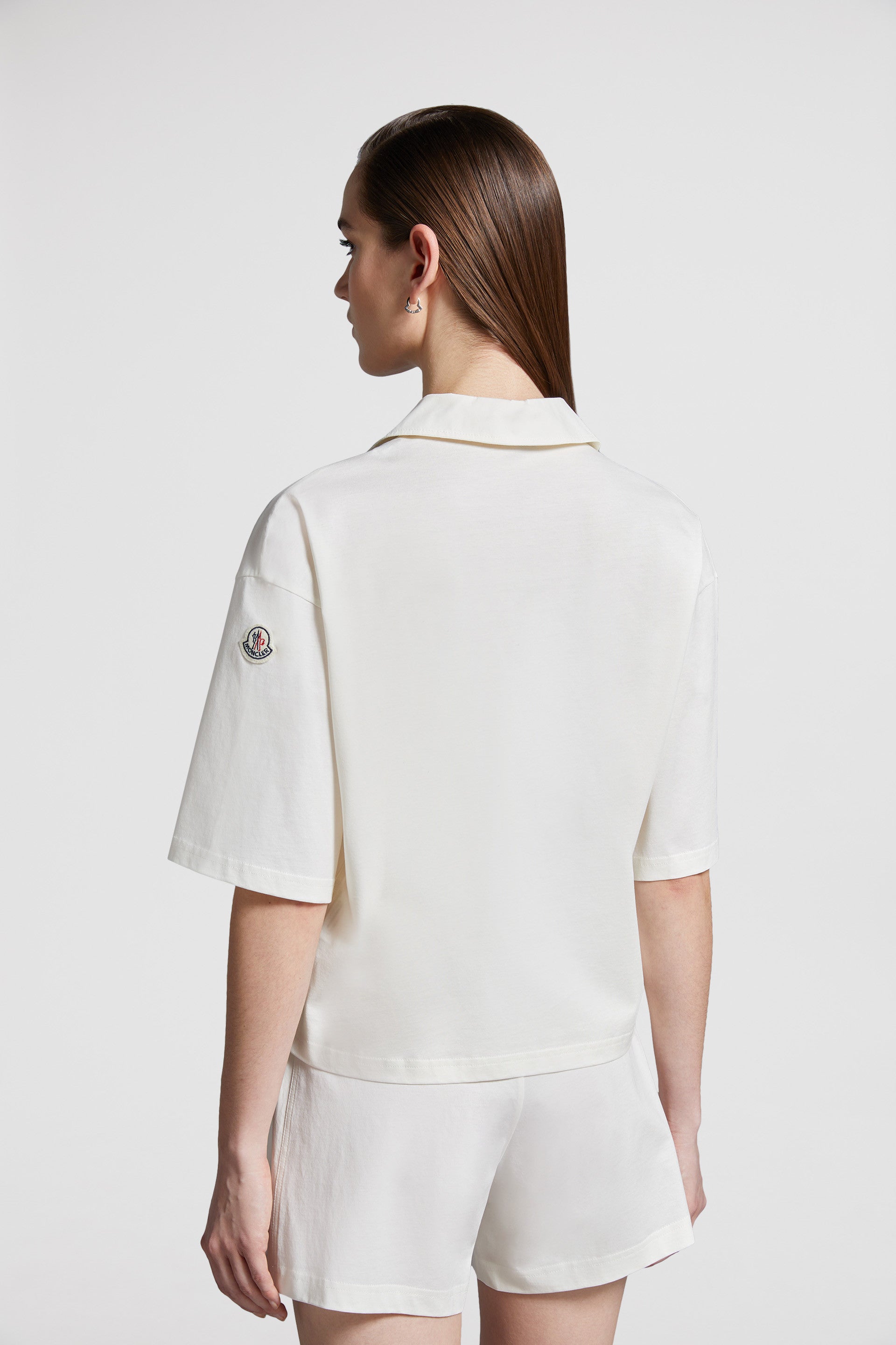 Moncler polo shirt, luxury casual polo, classic white polo, high-end fashion, refined elegance