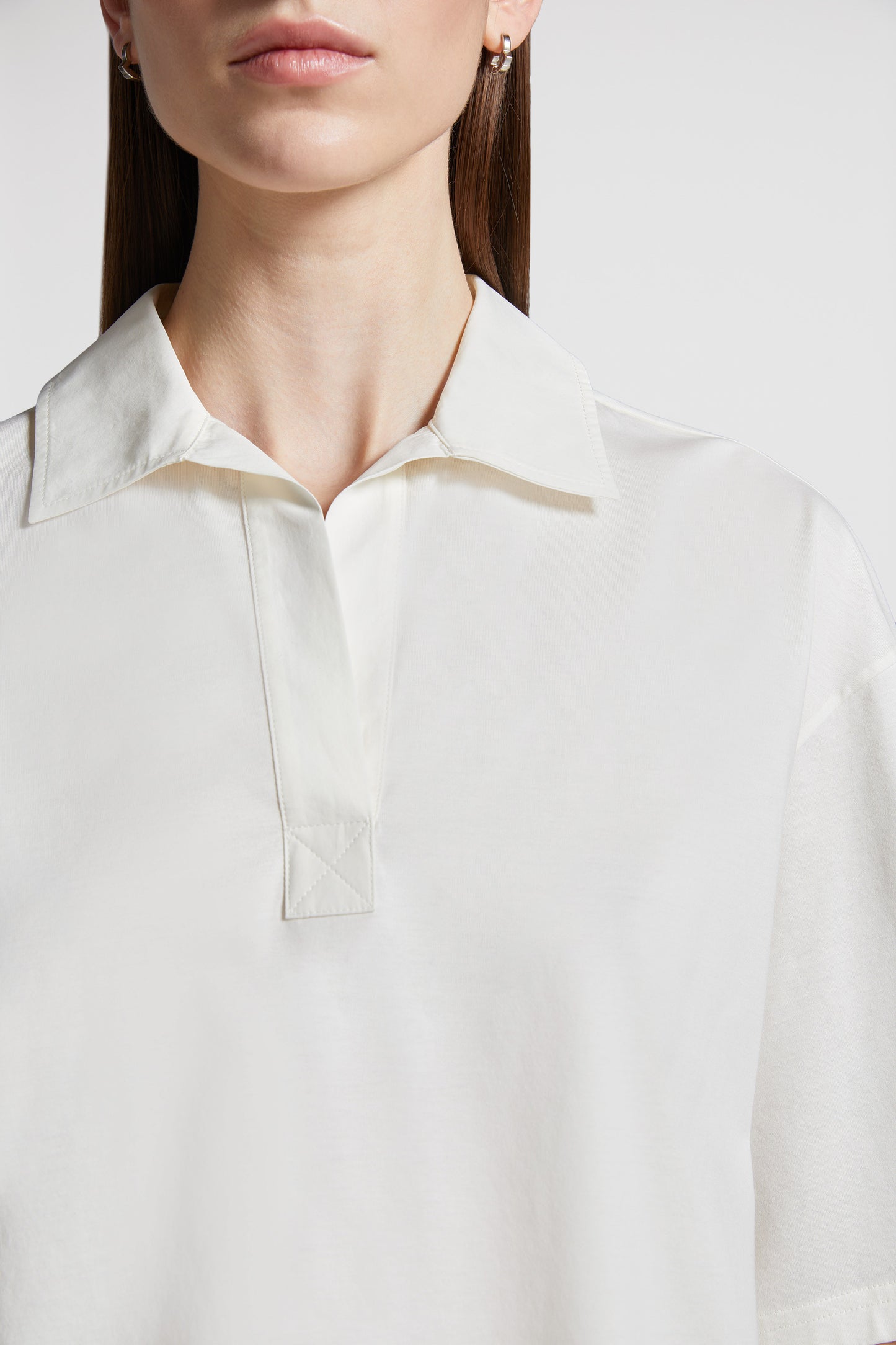 Moncler polo shirt, luxury casual polo, classic white polo, high-end fashion, refined elegance