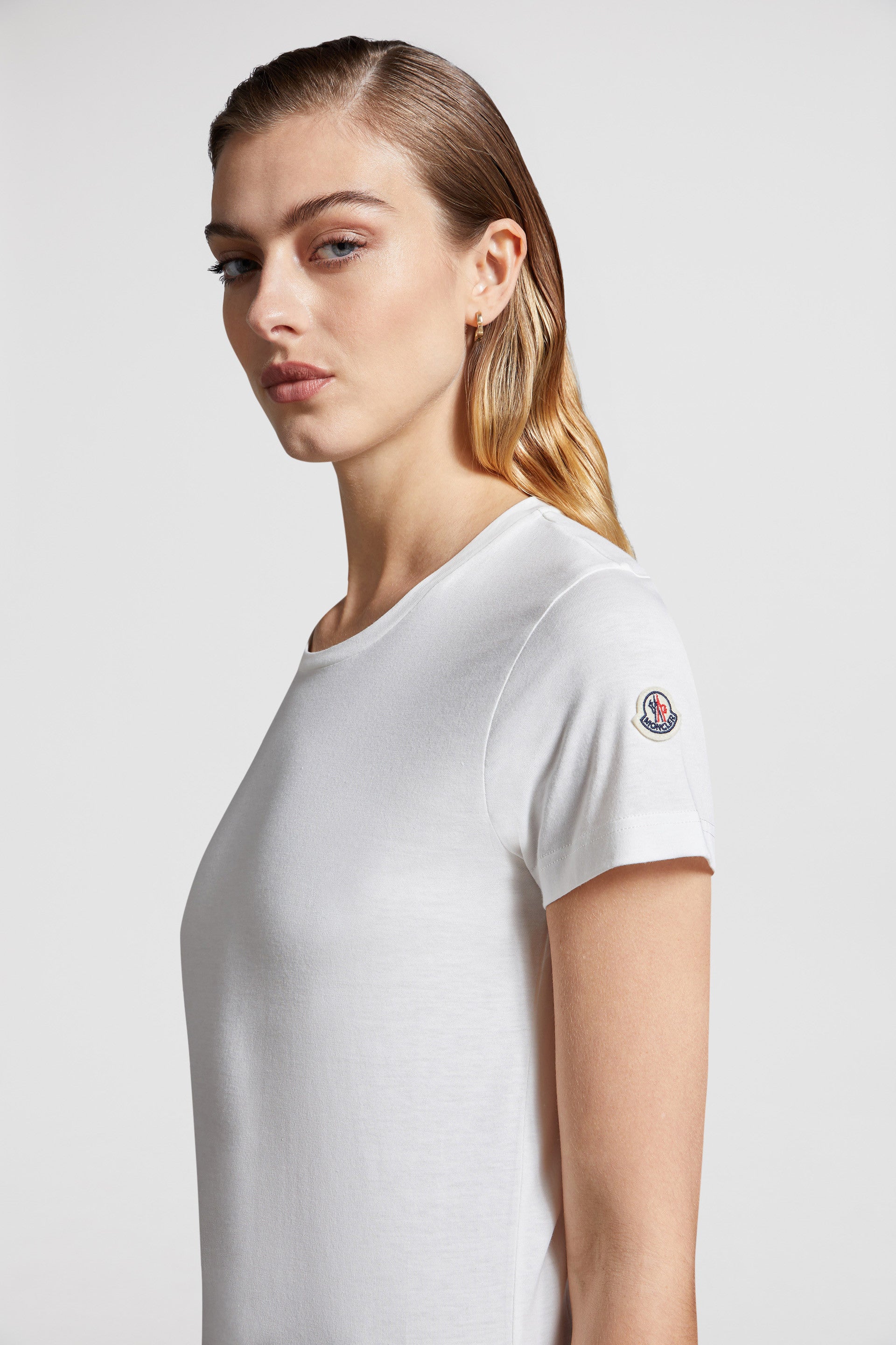 White T-shirt, Moncler logo, luxury casual wear, high-end fashion, designer T-shirt.