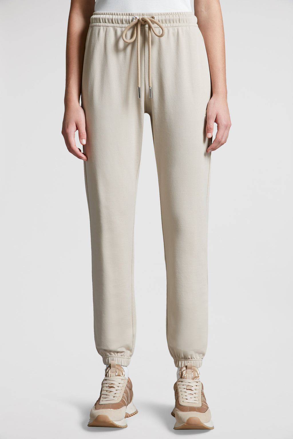 beige jogging pants, Moncler, logo jogging pants, luxury loungewear, cotton joggers