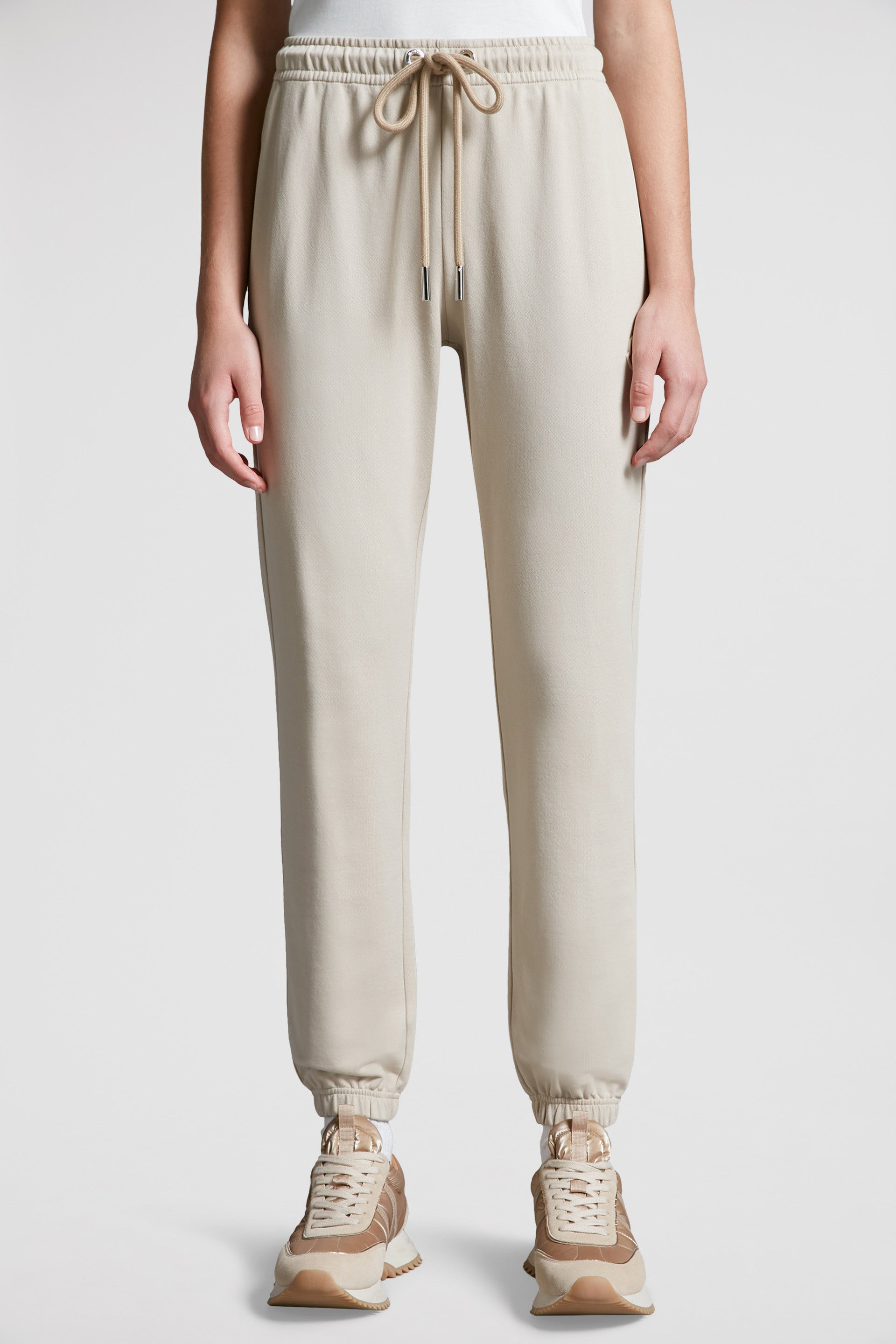 beige jogging pants, Moncler, logo jogging pants, luxury loungewear, cotton joggers