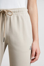 beige jogging pants, Moncler, logo jogging pants, luxury loungewear, cotton joggers