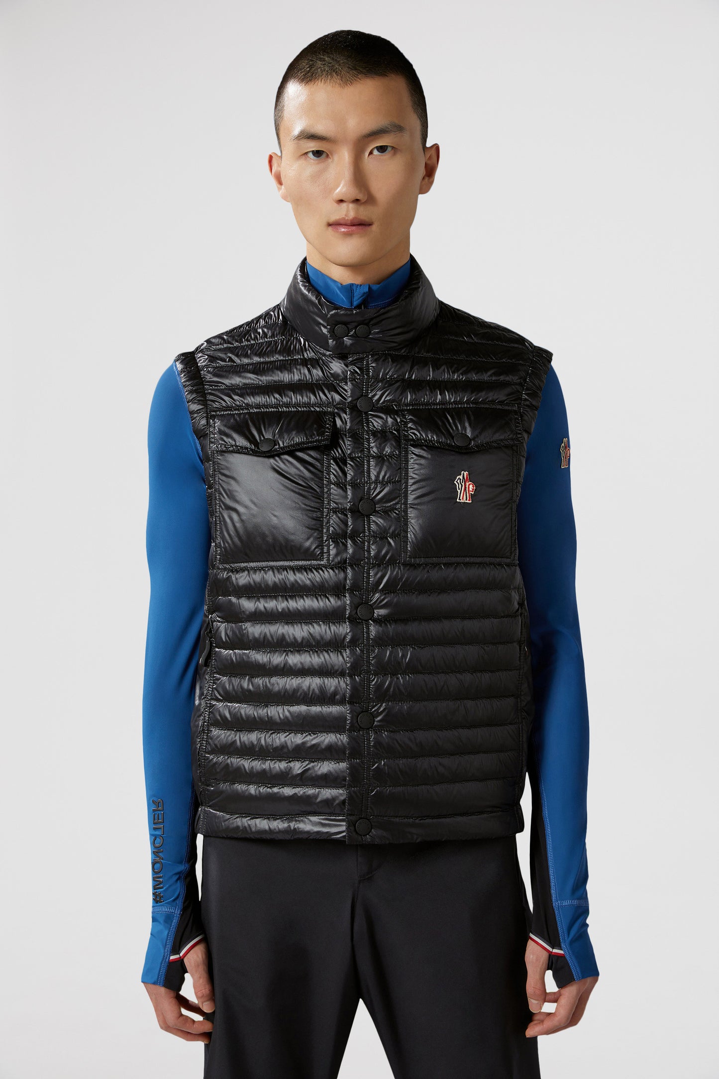 luxury vest, padded nylon vest, Moncler Grenoble vest, black sleeveless jacket, high-end outerwear