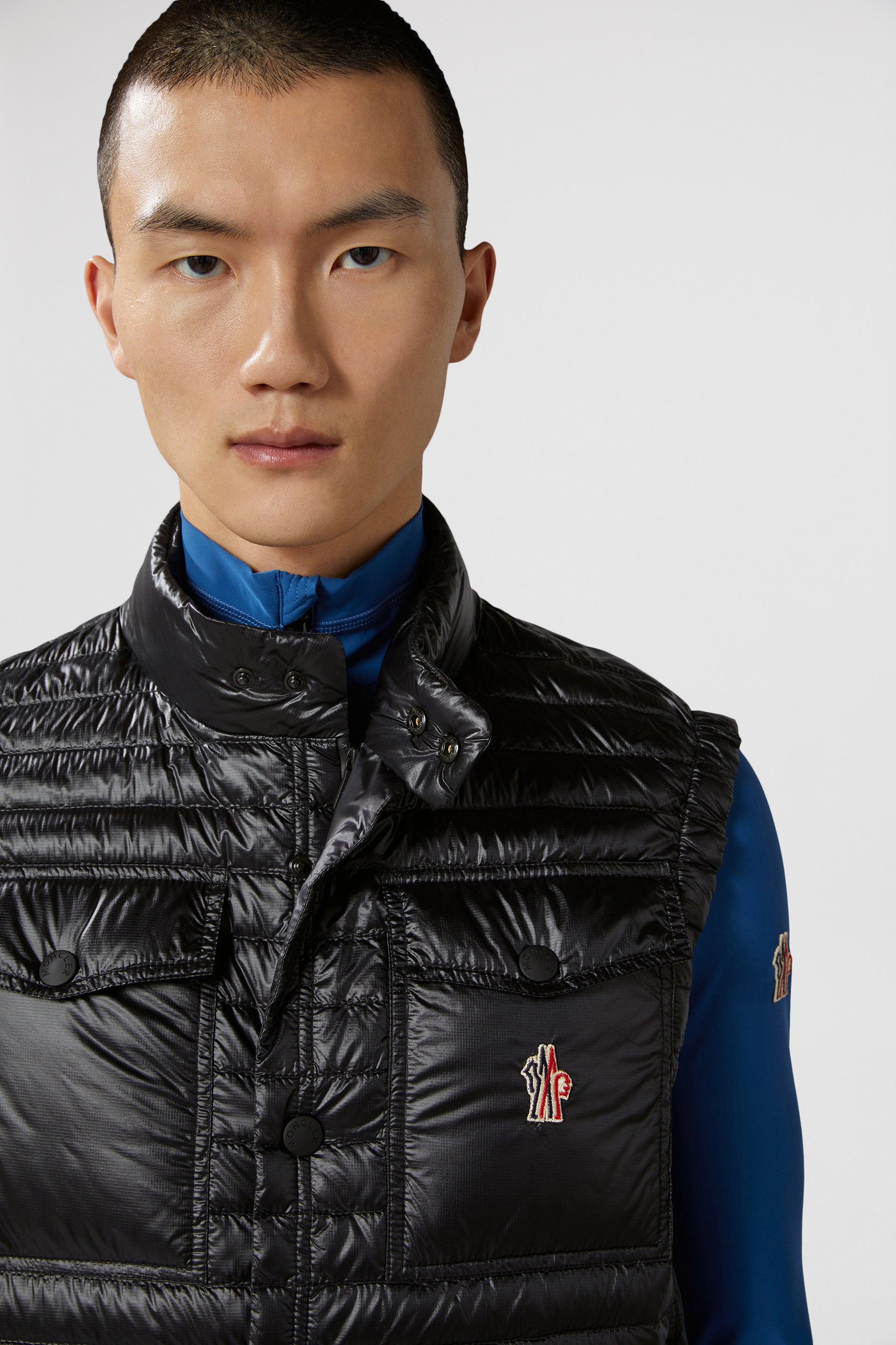 luxury vest, padded nylon vest, Moncler Grenoble vest, black sleeveless jacket, high-end outerwear