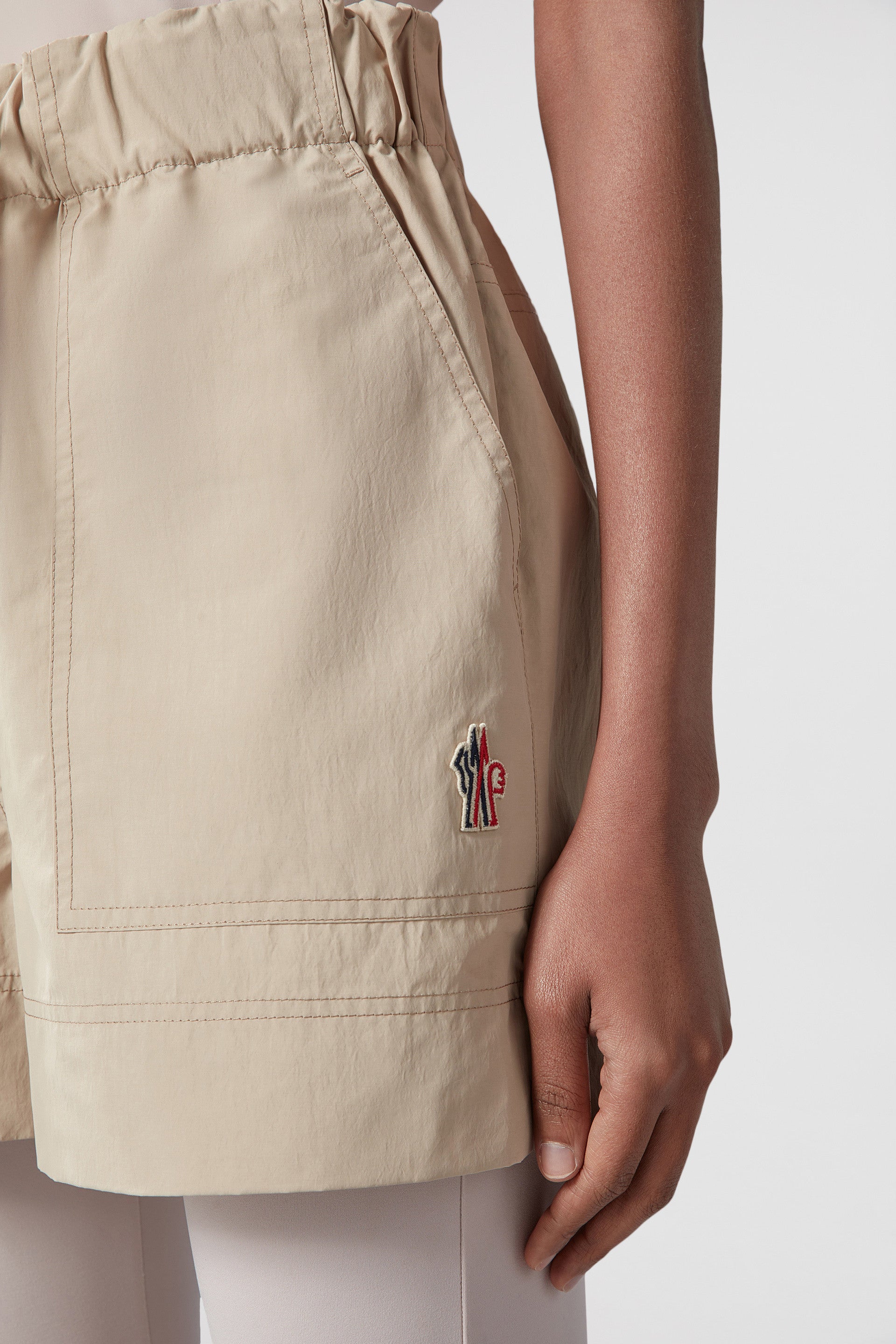 beige nylon shorts, Moncler Grenoble, luxury leisurewear, Spring-Summer 2024, technical crinkled fabric