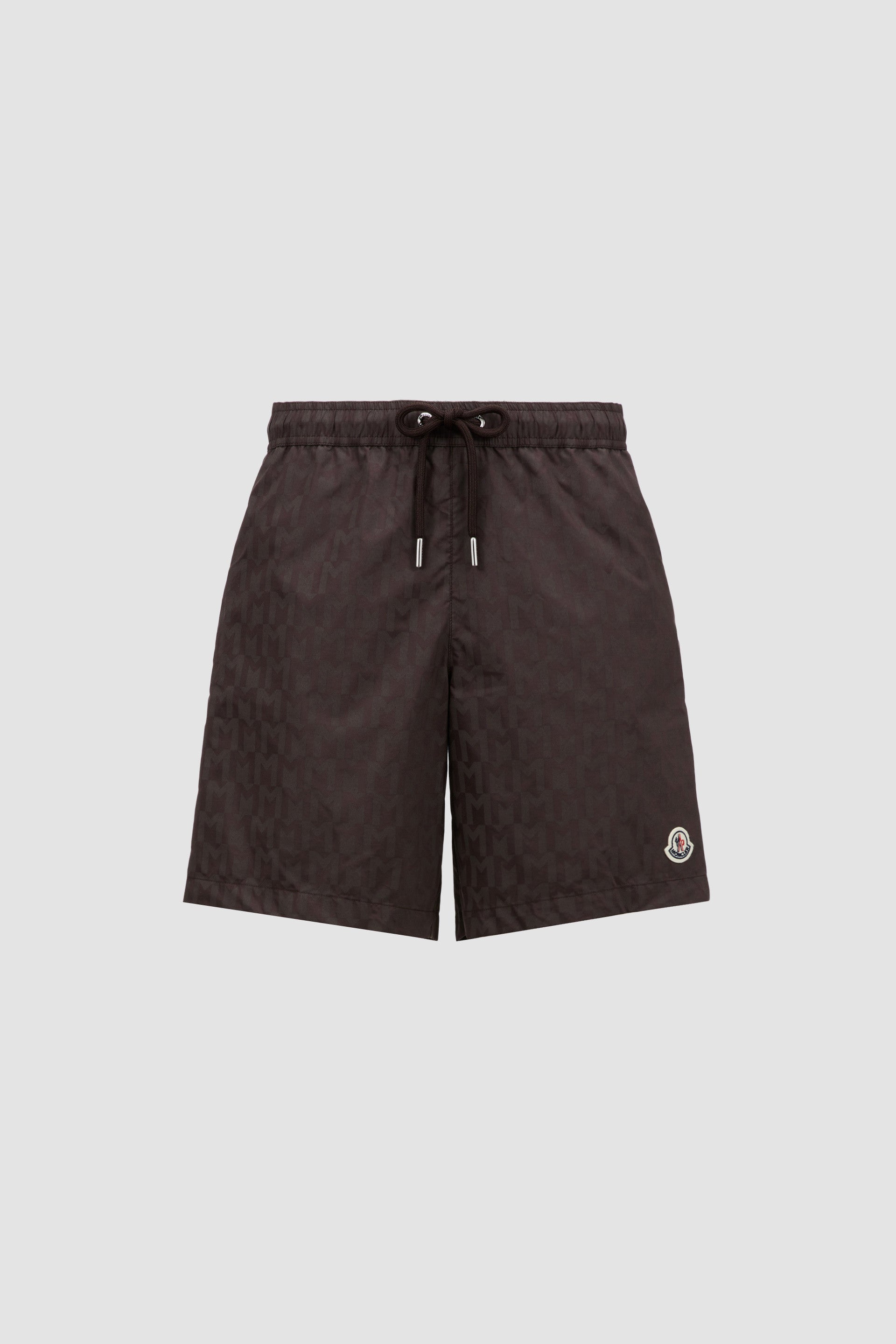 Monogram swim shorts, brown swim shorts, designer swimwear, Moncler shorts, men's swim fashion