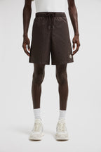 Monogram swim shorts, brown swim shorts, designer swimwear, Moncler shorts, men's swim fashion