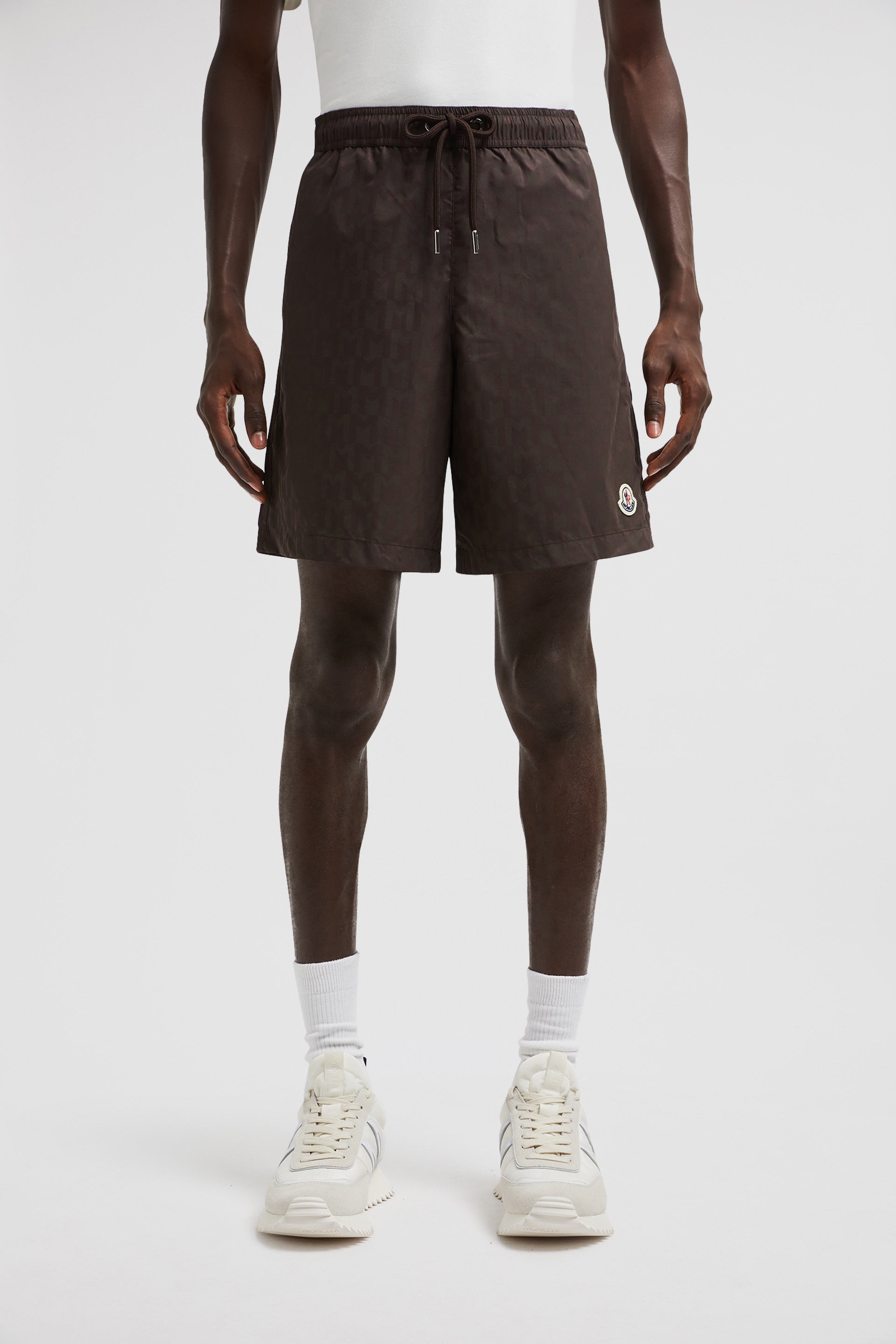 Monogram swim shorts, brown swim shorts, designer swimwear, Moncler shorts, men's swim fashion