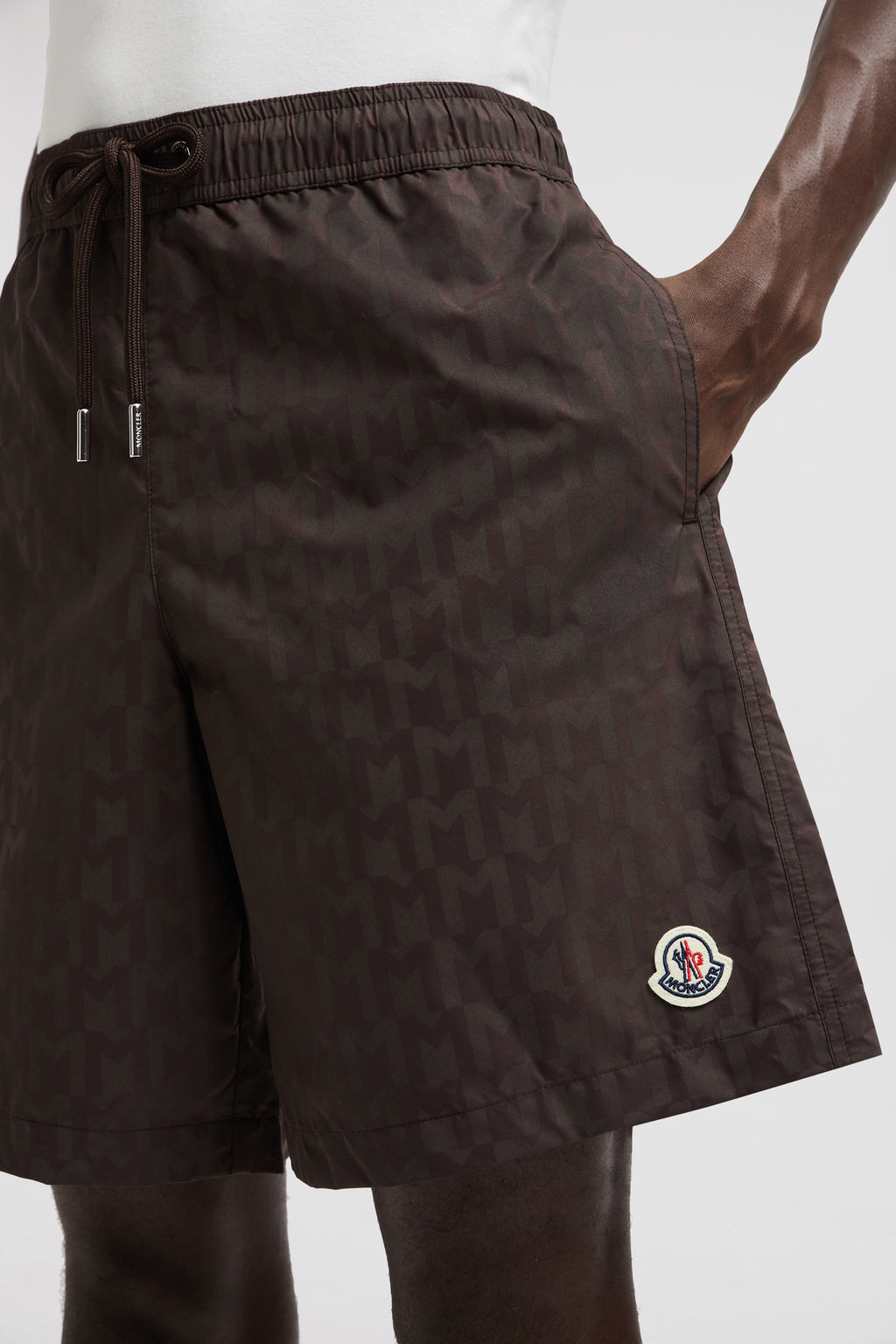 Monogram swim shorts, brown swim shorts, designer swimwear, Moncler shorts, men's swim fashion