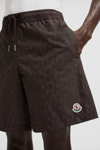 Monogram swim shorts, brown swim shorts, designer swimwear, Moncler shorts, men's swim fashion