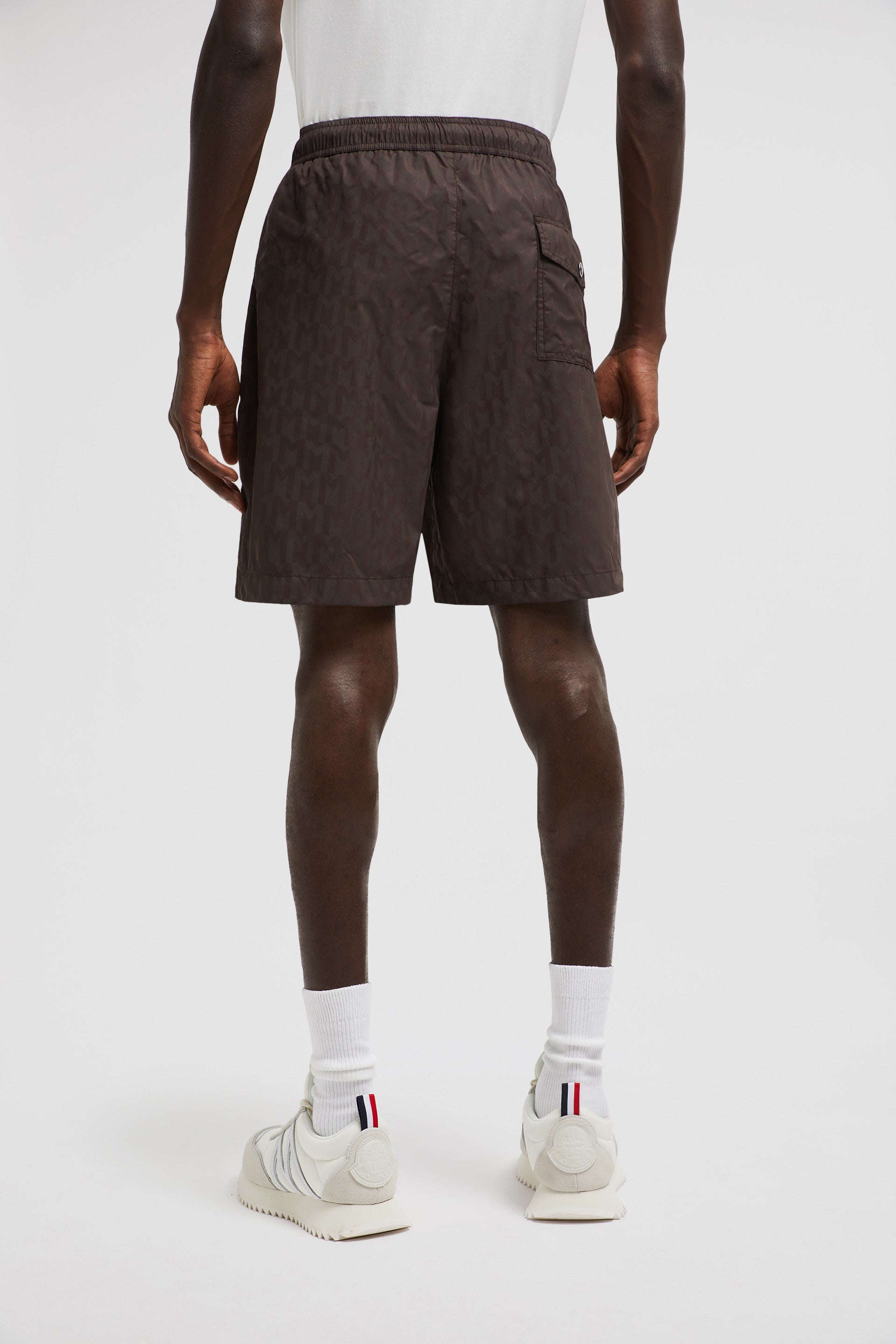 Monogram swim shorts, brown swim shorts, designer swimwear, Moncler shorts, men's swim fashion