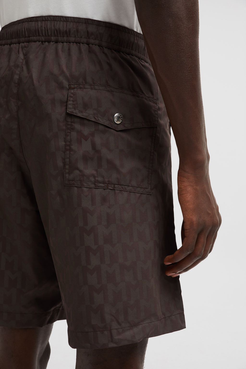 Monogram swim shorts, brown swim shorts, designer swimwear, Moncler shorts, men's swim fashion