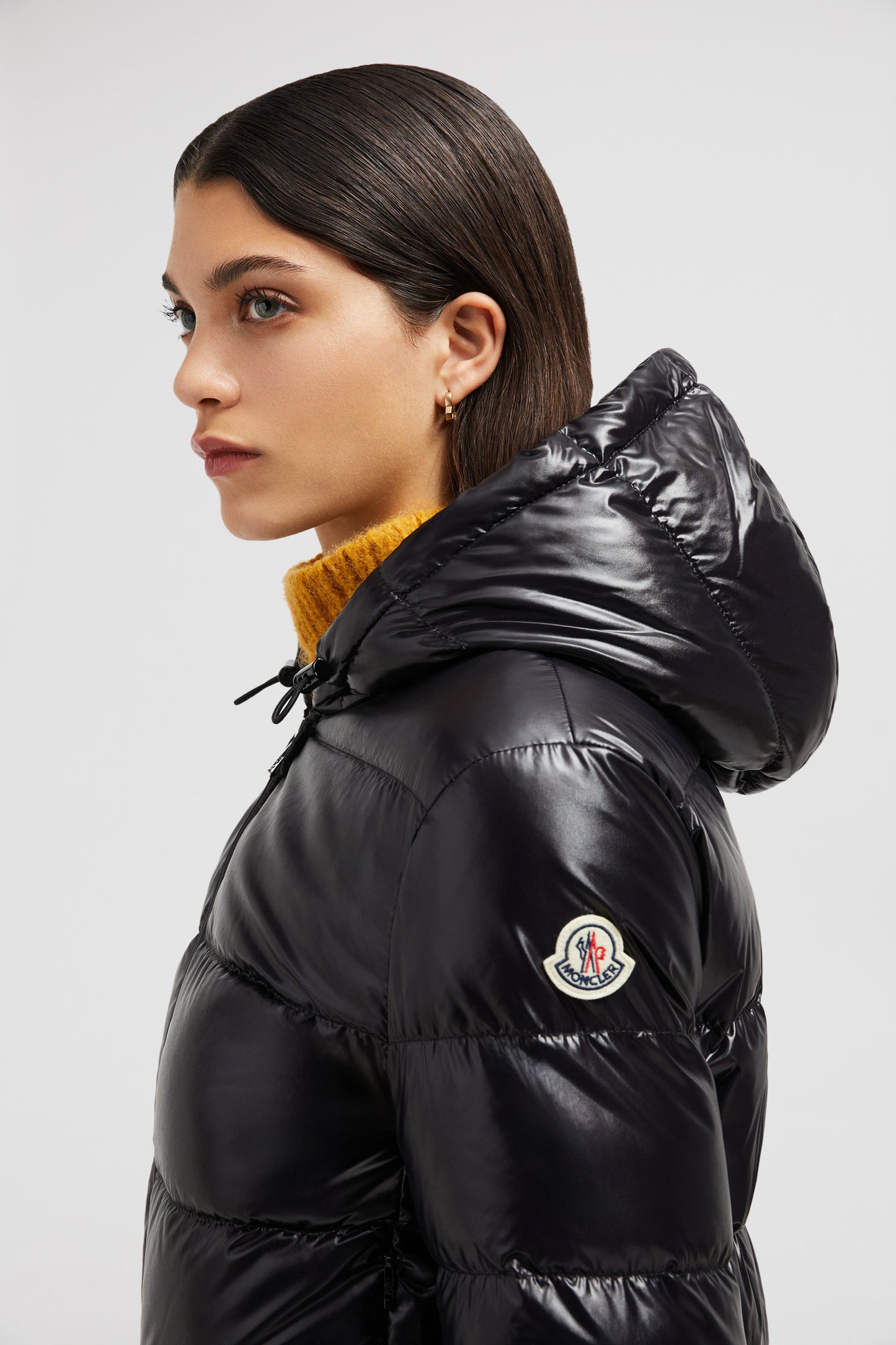 Moncler jacket, luxury outerwear, black nylon jacket, fashionable winter coat, elegant women’s attire