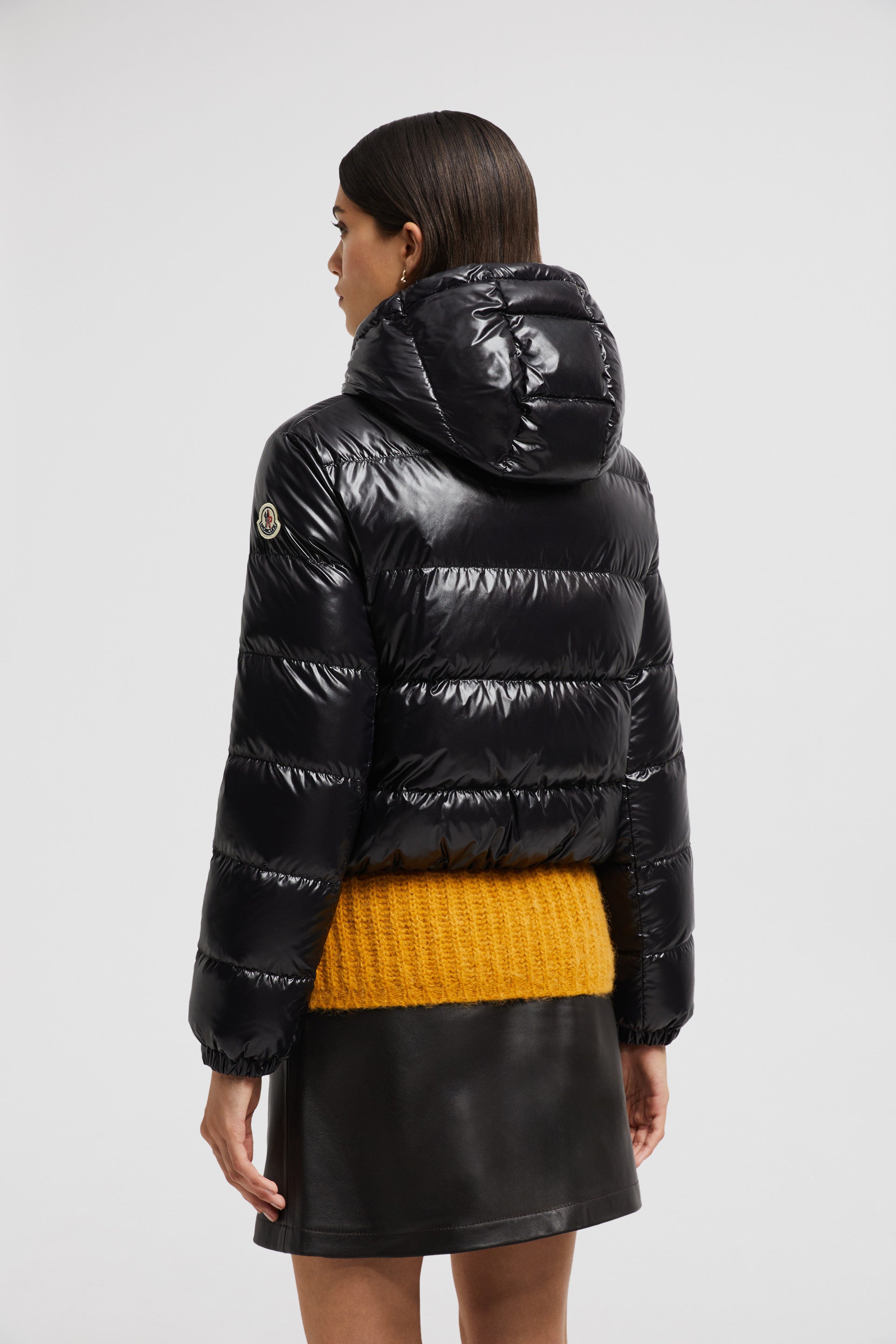 Moncler jacket, luxury outerwear, black nylon jacket, fashionable winter coat, elegant women’s attire