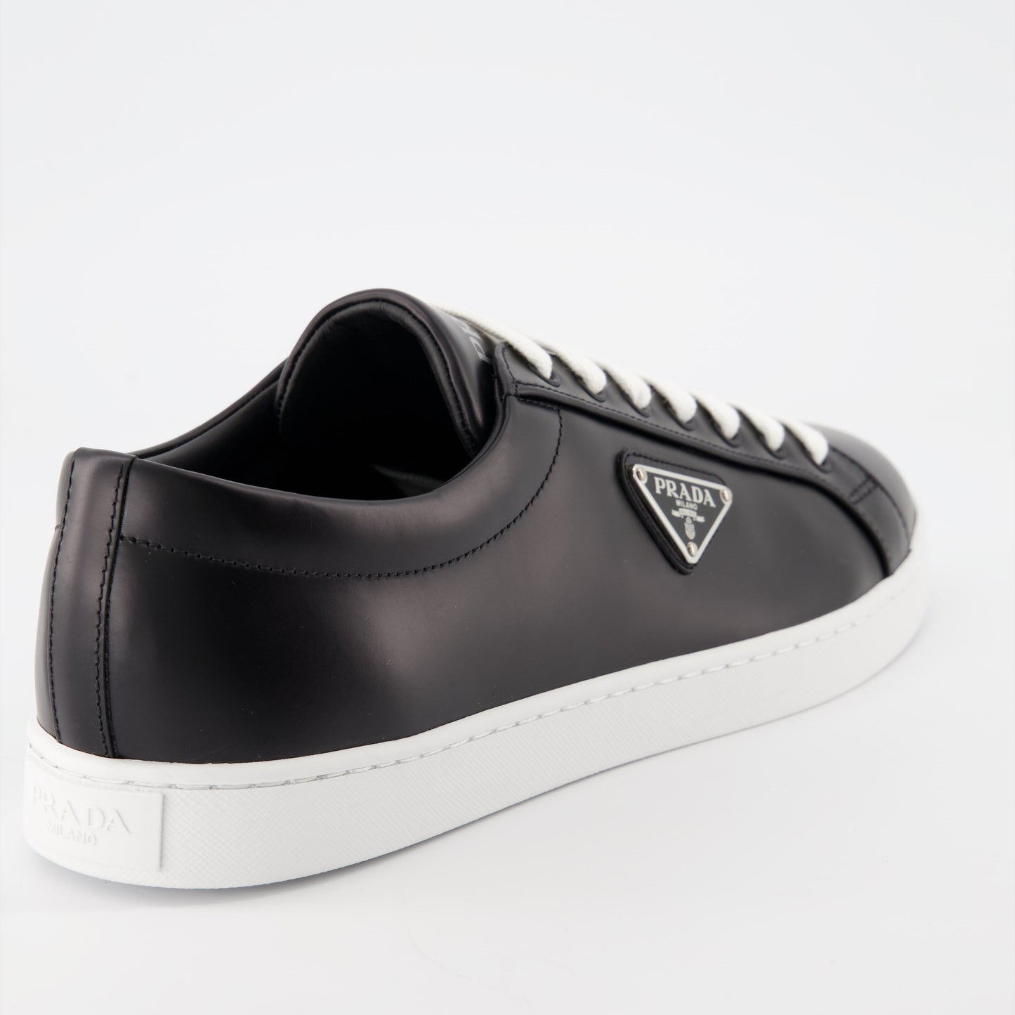 black leather sneakers, elegant footwear, men's sneaker style, contrast sole design, signature logo sneakers