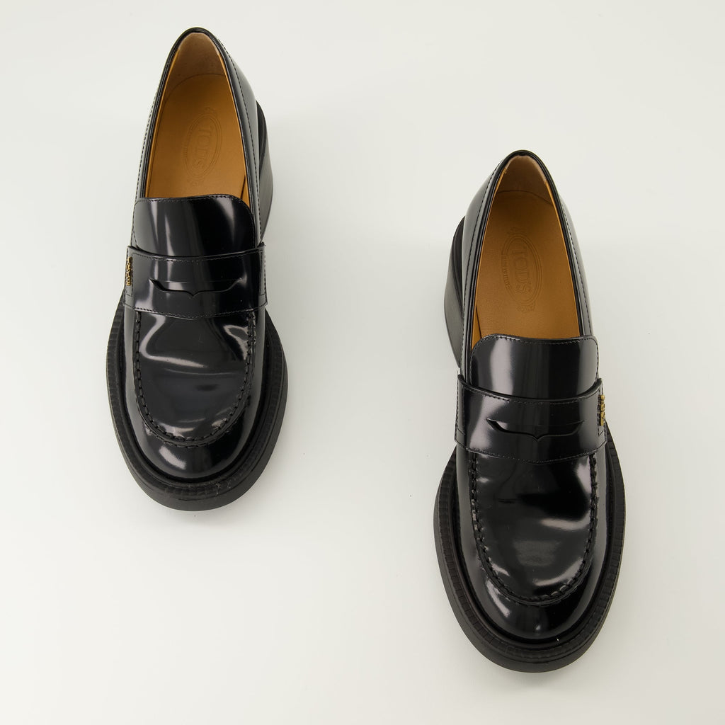 black leather moccasins, Tod's footwear, elegant slip-on shoes, autumn winter collection, women's moccasins