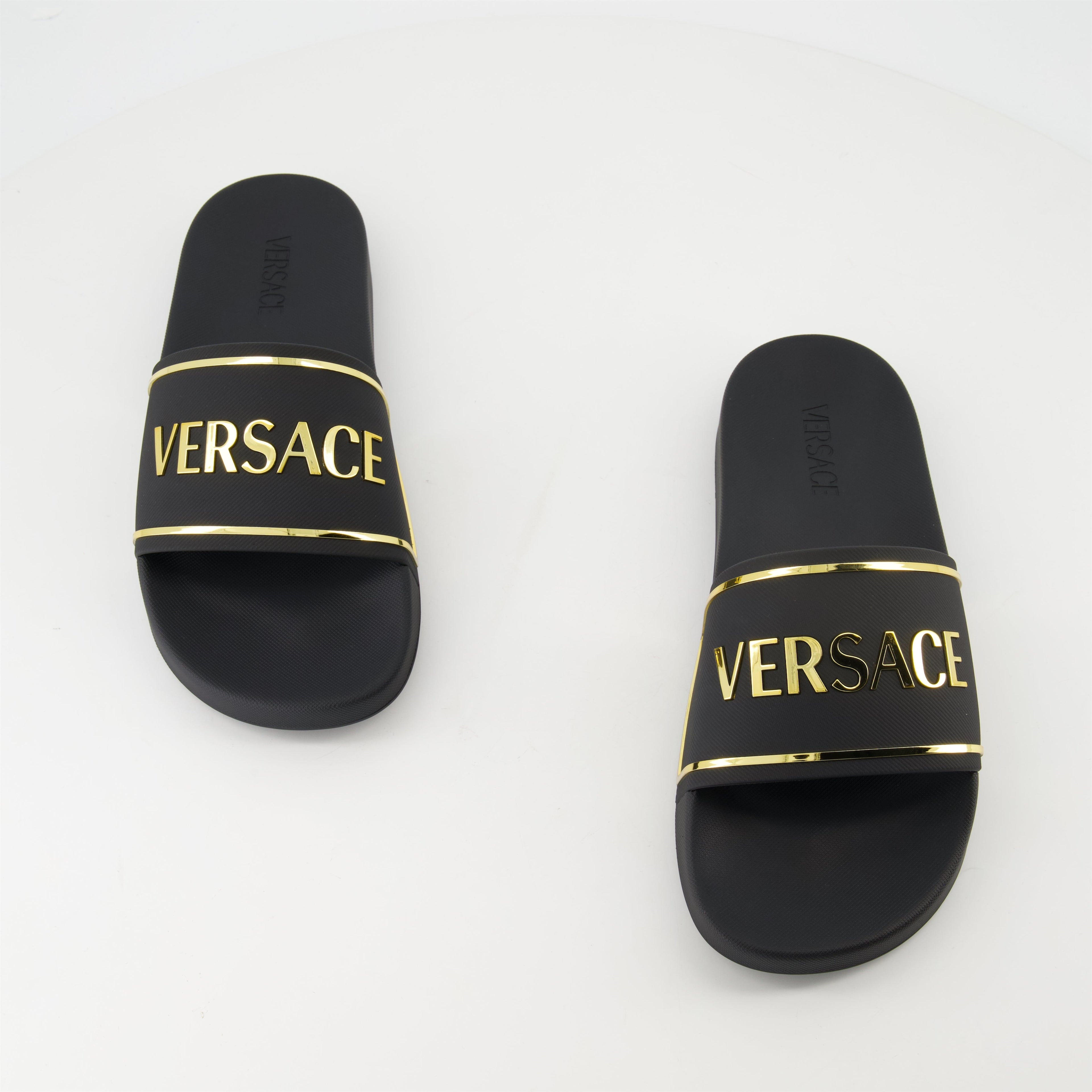 gold logo slides, Versace slides, comfortable rubber footwear, contemporary slides, stylish casual footwear