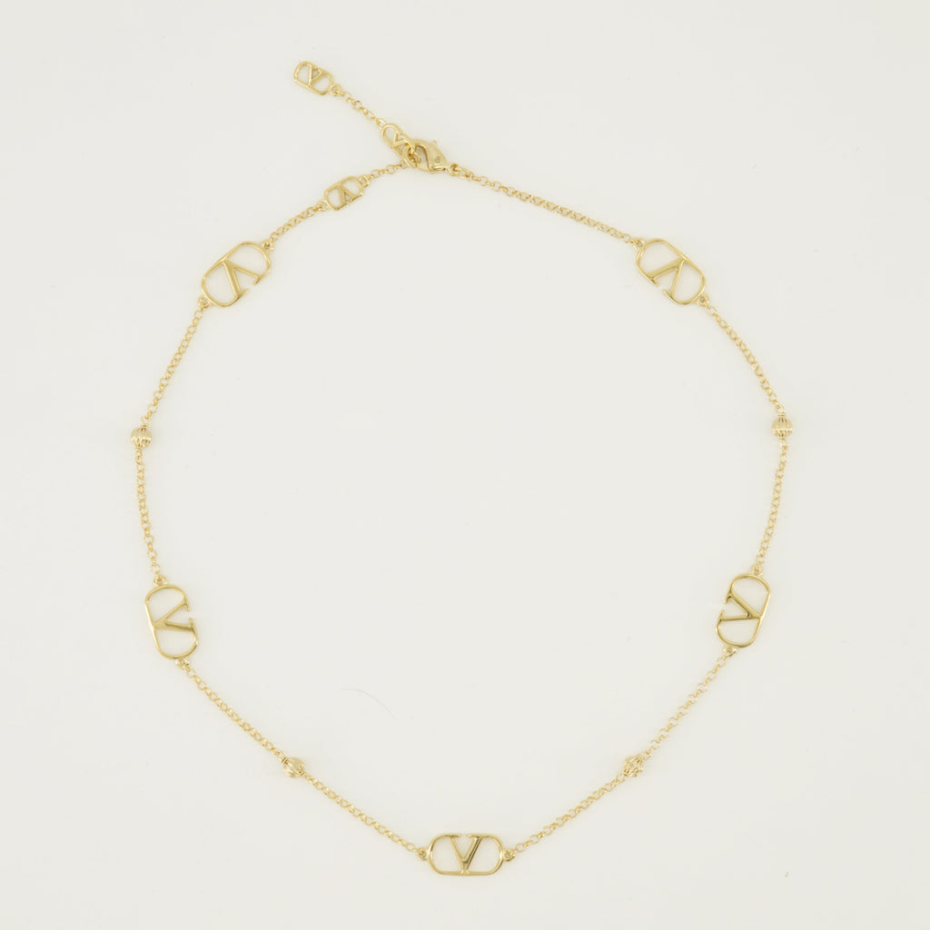バレンティノ・ガラヴァーニの女性用Vlogoゴールドネックレスの画像 - 2026年春夏シーズン - 正面ビュー