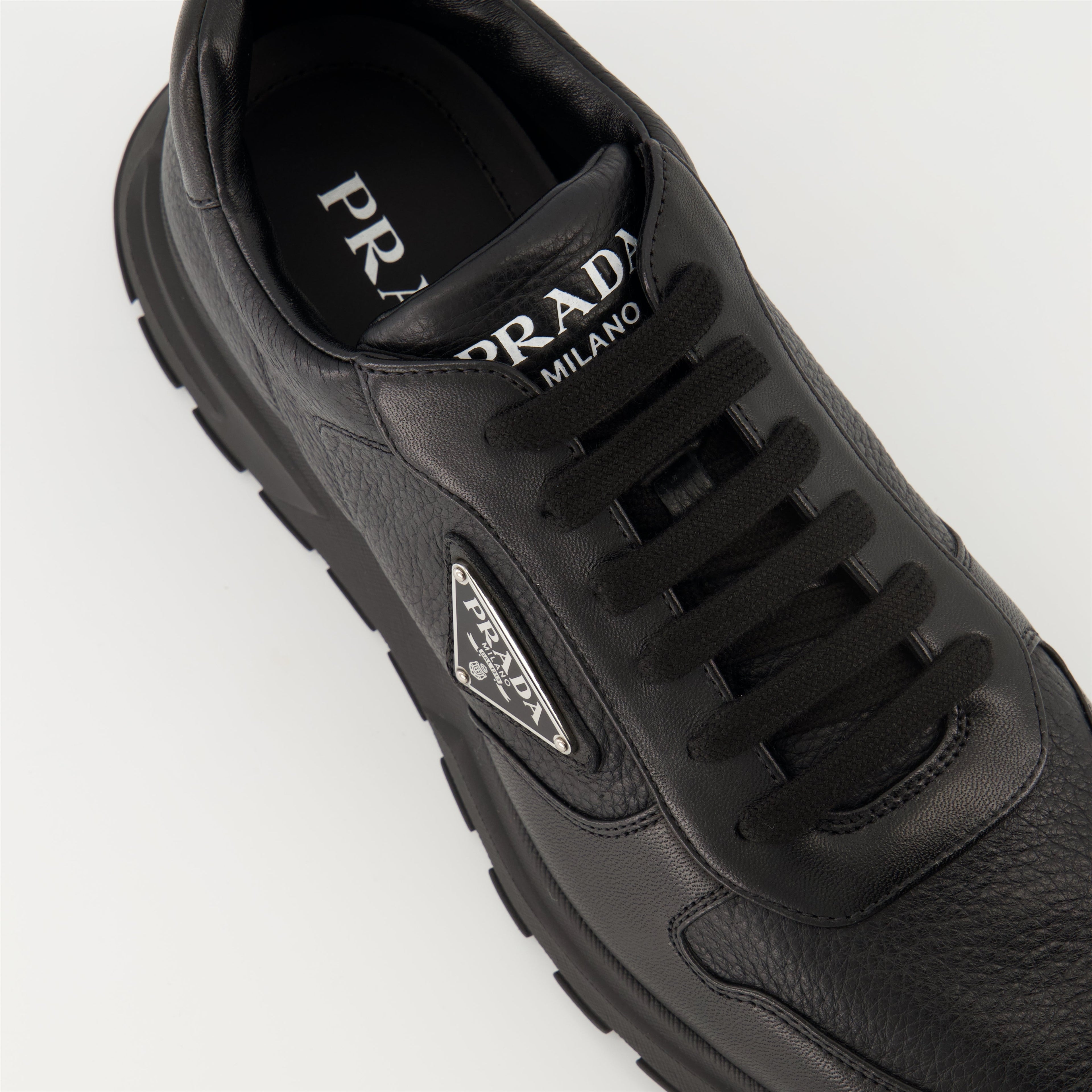 Prada sneakers, black leather sneakers, Prax 01 model, men's footwear, luxury menswear