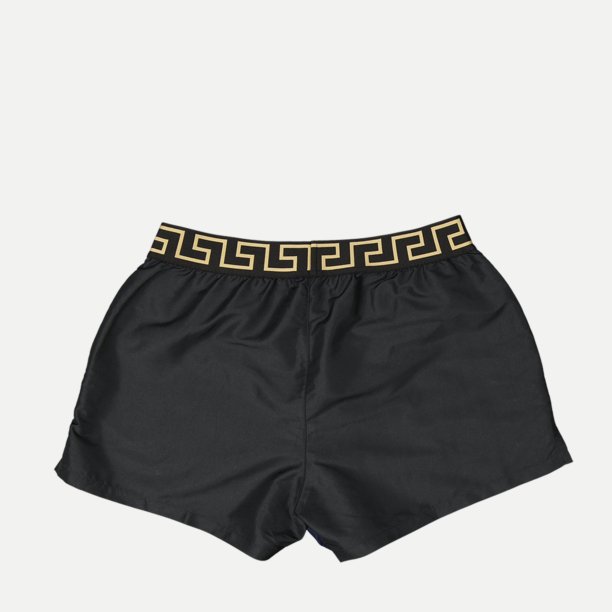 Greca swim shorts, Versace swimwear, black swim shorts, sustainable fashion, Medusa motif