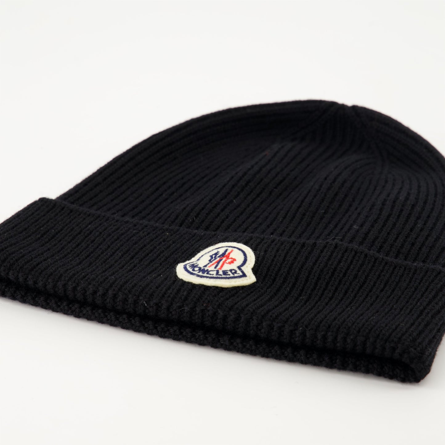   
Black wool beanie, Moncler beanie, luxury winter accessory, ribbed wool beanie, stylish logo hat  
