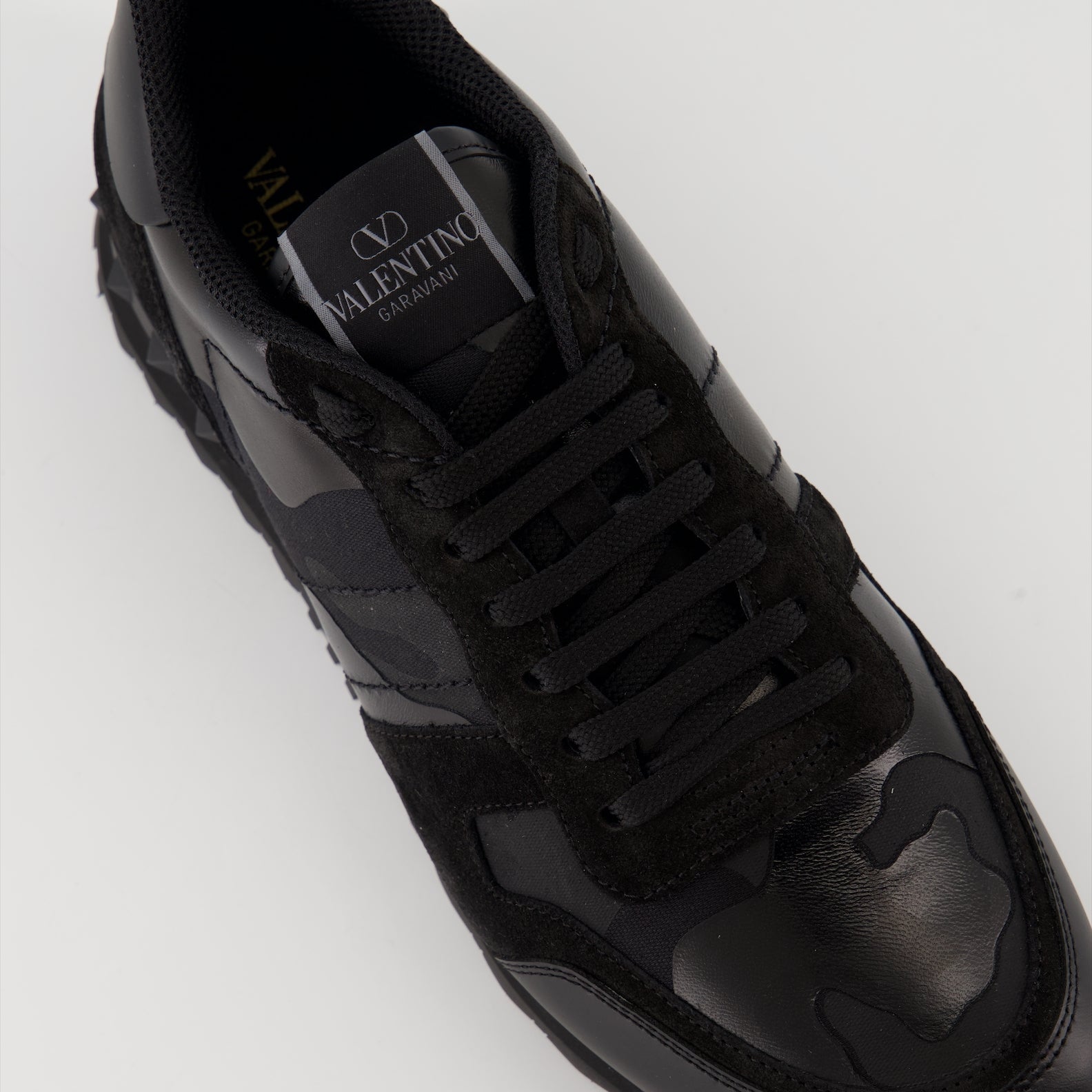 Valentino Garavani sneakers, Rockrunner leather sneakers, luxury footwear, black suede sneakers, high-end sneakers