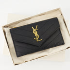 black cardholder, Saint Laurent, textured leather accessory, YSL logo, luxury cardholder
