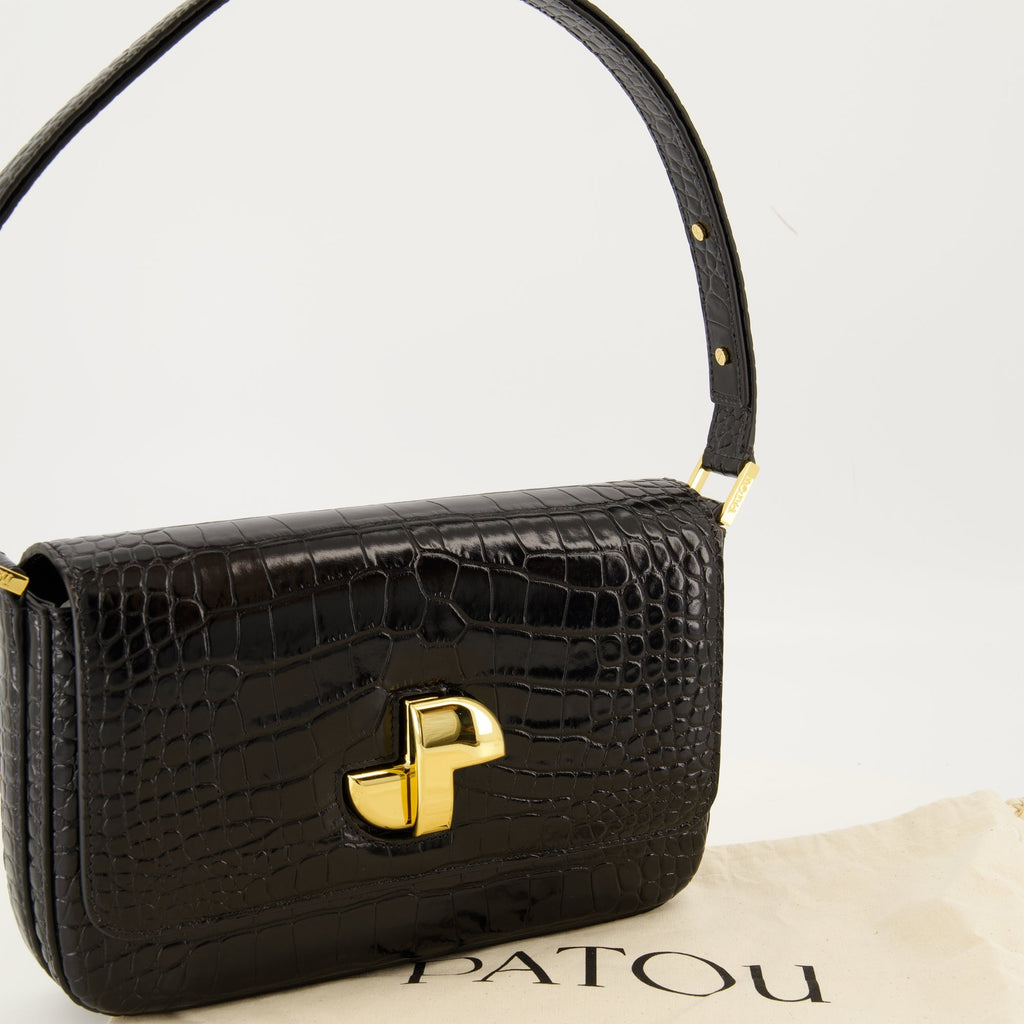 Patou handbag, croco-effect leather bag, elegant black handbag, Art Deco clasp, adjustable handle handbag