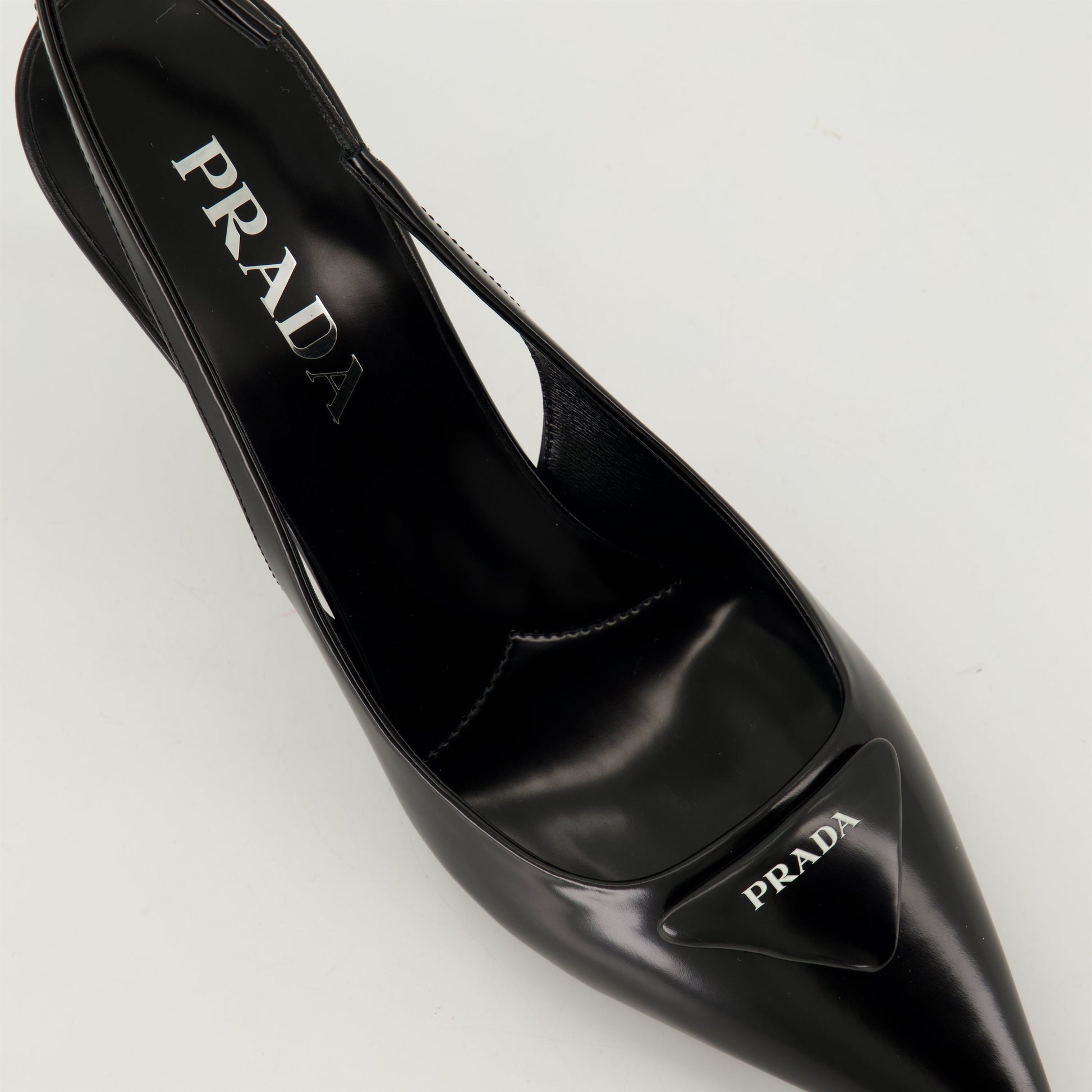 pointed toe pump, black leather shoe, Prada pump, elegant footwear, leather heel