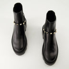 Imagen de las botas de tobillo de cuero Rockstud de Valentino Garavani para mujeres - Temporada Otoño-Invierno 2024 - Vista superior de un par