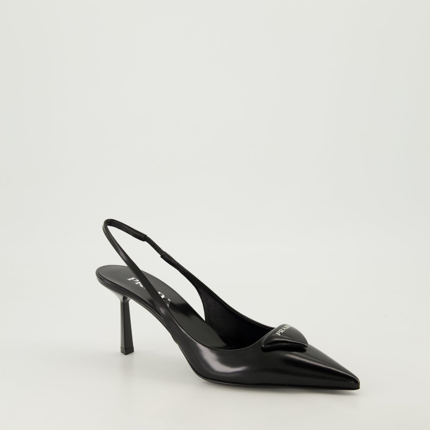 pointed toe pump, black leather shoe, Prada pump, elegant footwear, leather heel