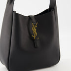 black leather bag, Saint Laurent, grained leather, elegant handbag, adjustable strap