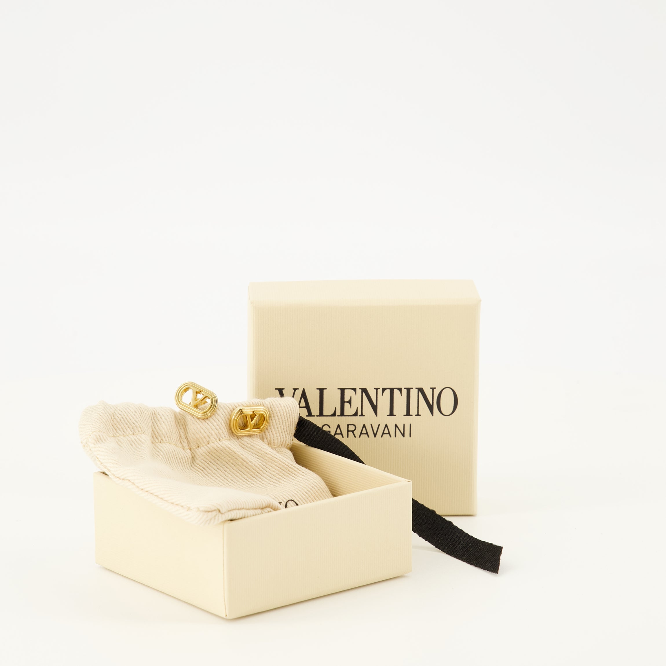 Valentino Garavani earrings, gold earrings, brass jewelry, VLogo accessories, chic earrings