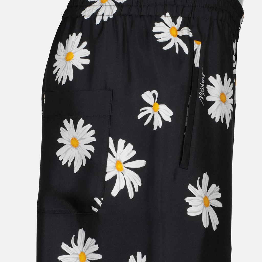 Image of Black Floral Silk Trousers by Moschino for Women - Season Spring-Summer 2025 - Detail View 1