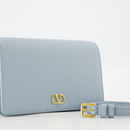 VLogo pouch, Valentino Garavani, leather accessory, spring-summer collection, blue handbag