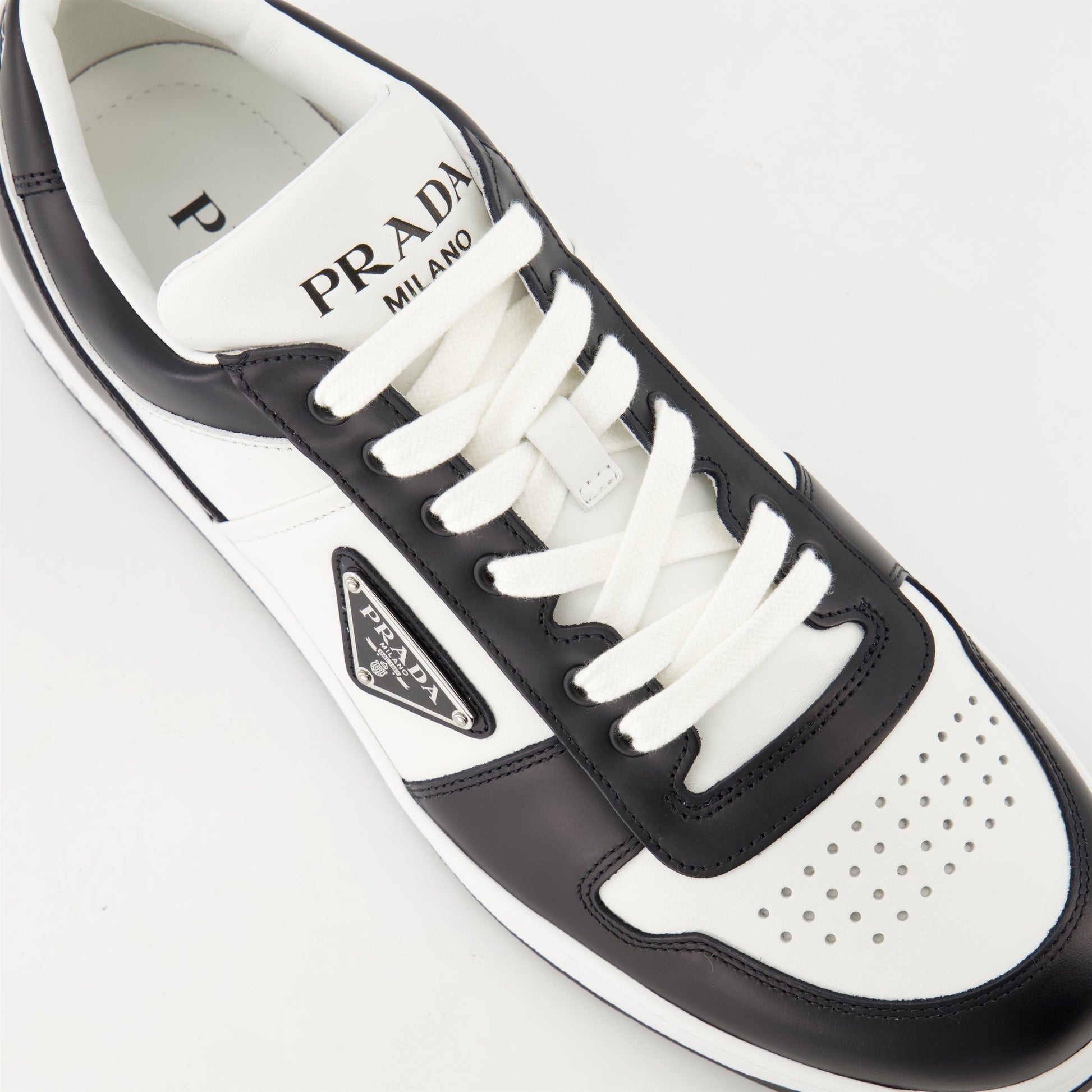 leather sneakers, black and white, Prada, rubber sole, triangle logo