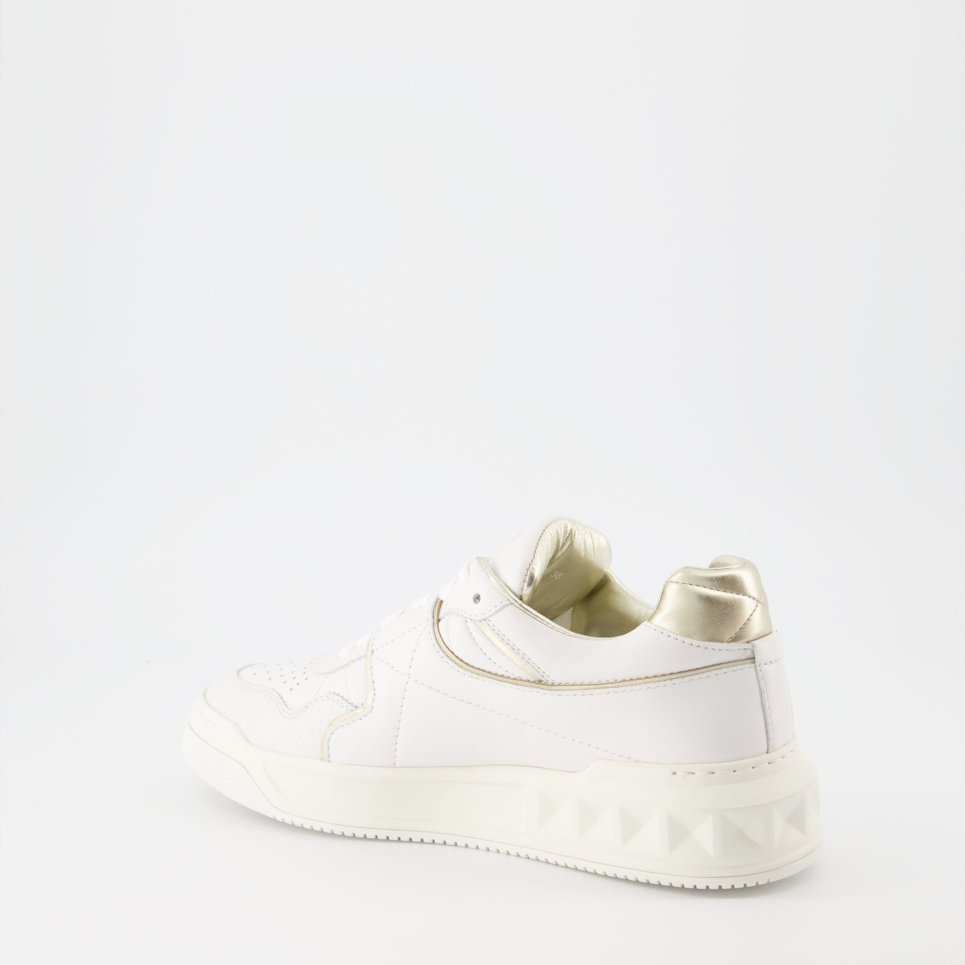 Valentino Garavani, women’s luxury sneakers, white and gold sneakers, One Stud sneakers, designer footwear