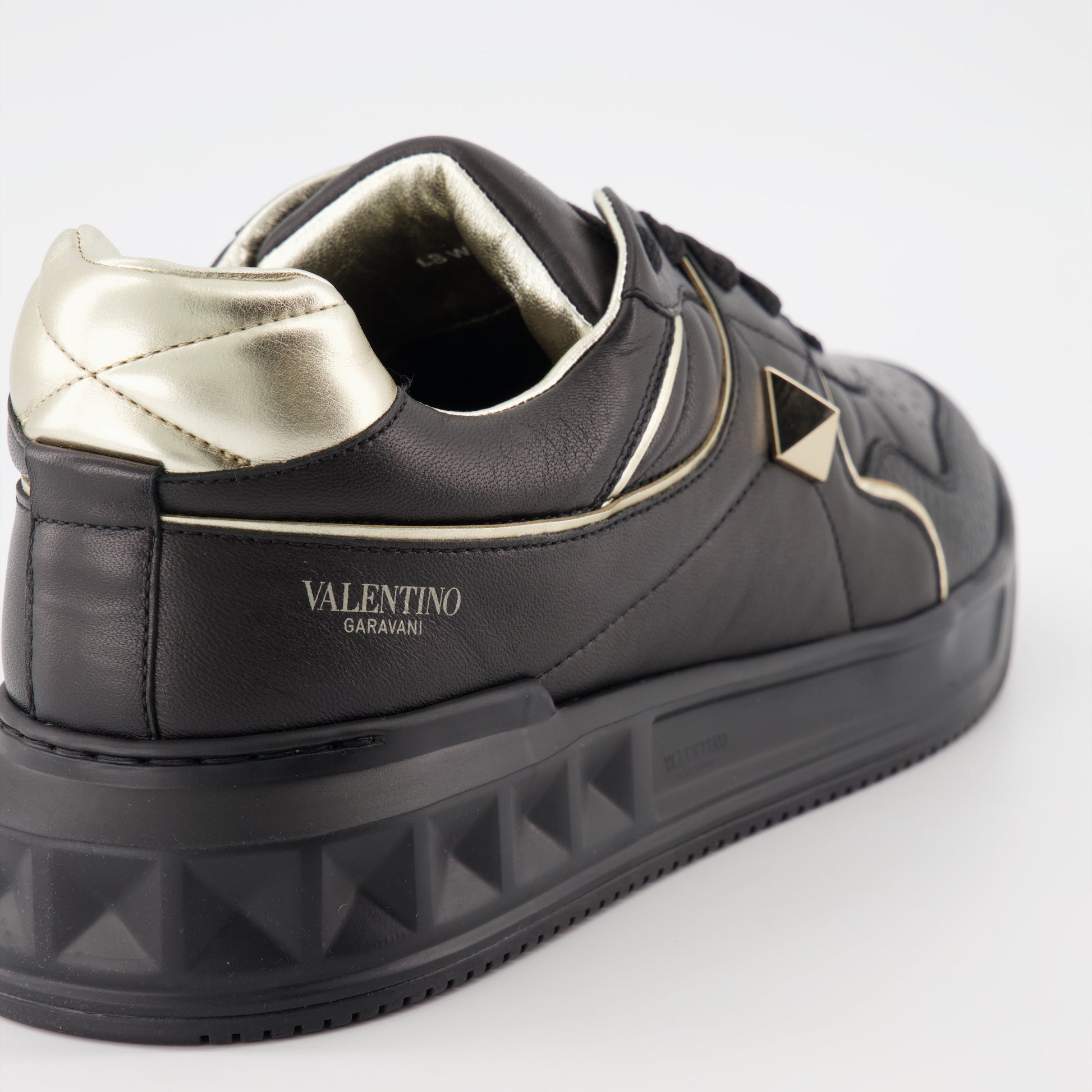 Valentino Garavani, luxury sneakers, men's fashion, designer footwear, black and gold sneakers