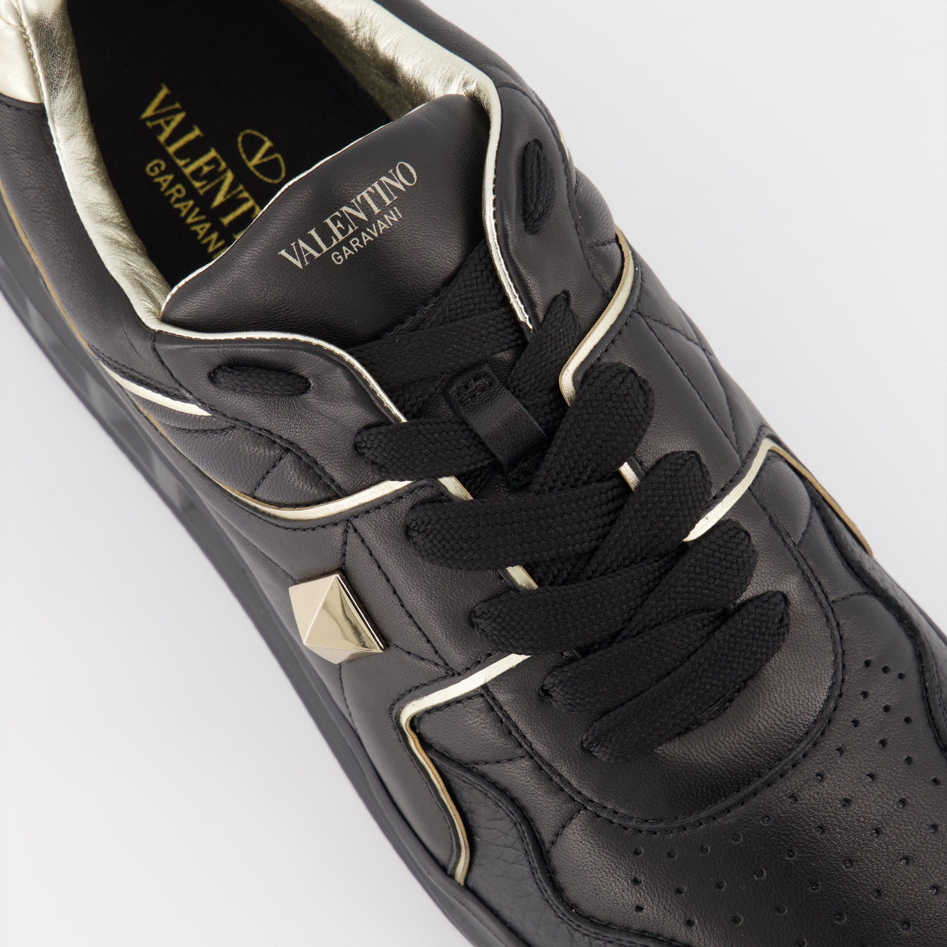 Valentino Garavani, luxury sneakers, men's fashion, designer footwear, black and gold sneakers