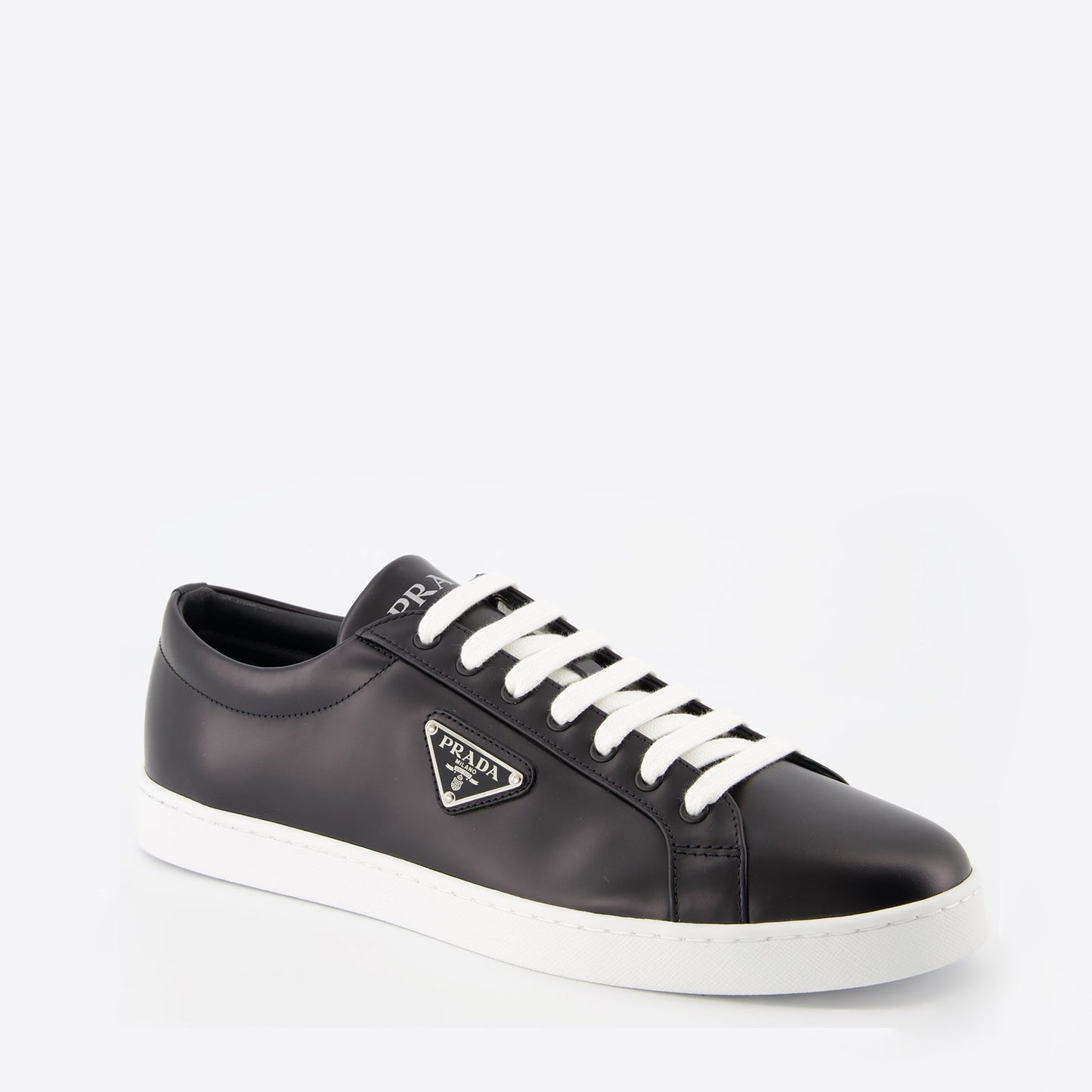 black leather sneakers, elegant footwear, men's sneaker style, contrast sole design, signature logo sneakers