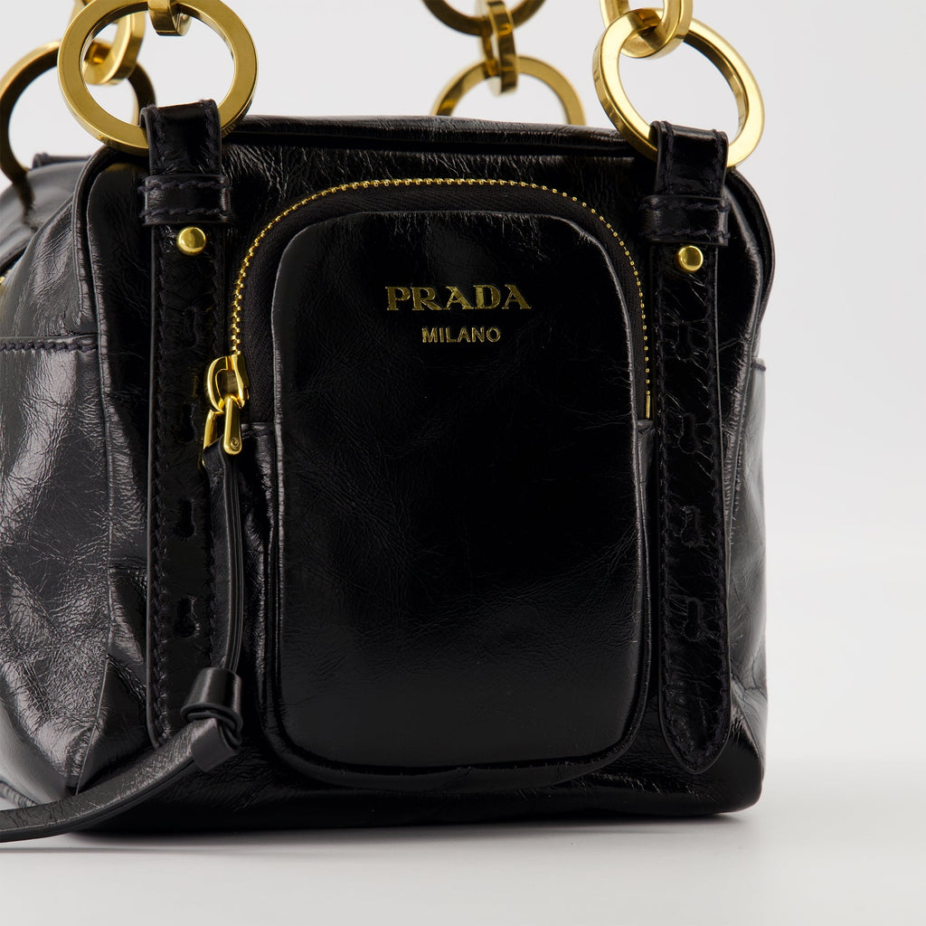 black leather bag, Prada mini bag, vintage leather accessory, zip closure handbag, stylish women's bag