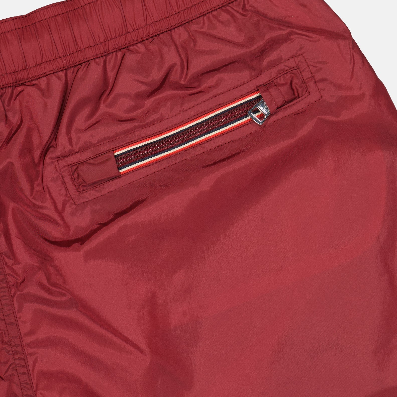 red swim shorts, logo swim shorts, Moncler swimwear, summer fashion, beachwear