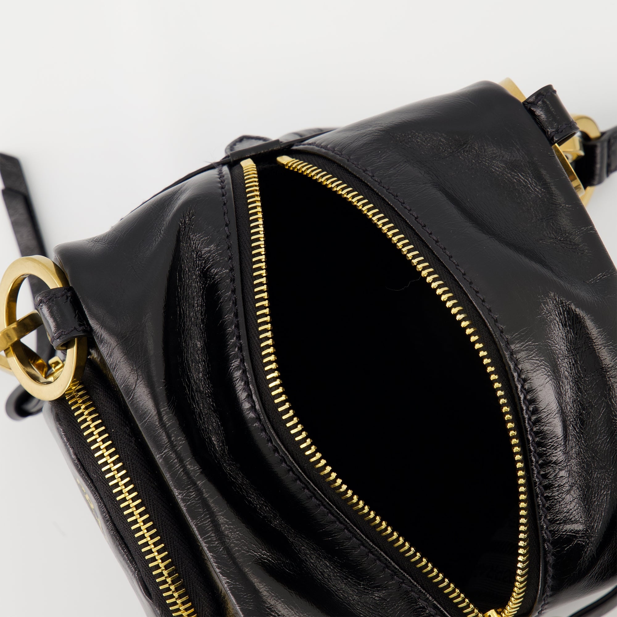 black leather bag, Prada mini bag, vintage leather accessory, zip closure handbag, stylish women's bag