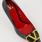   Valentino Garavani, black leather pumps, pointed-toe shoes, high-end fashion, luxury footwear
