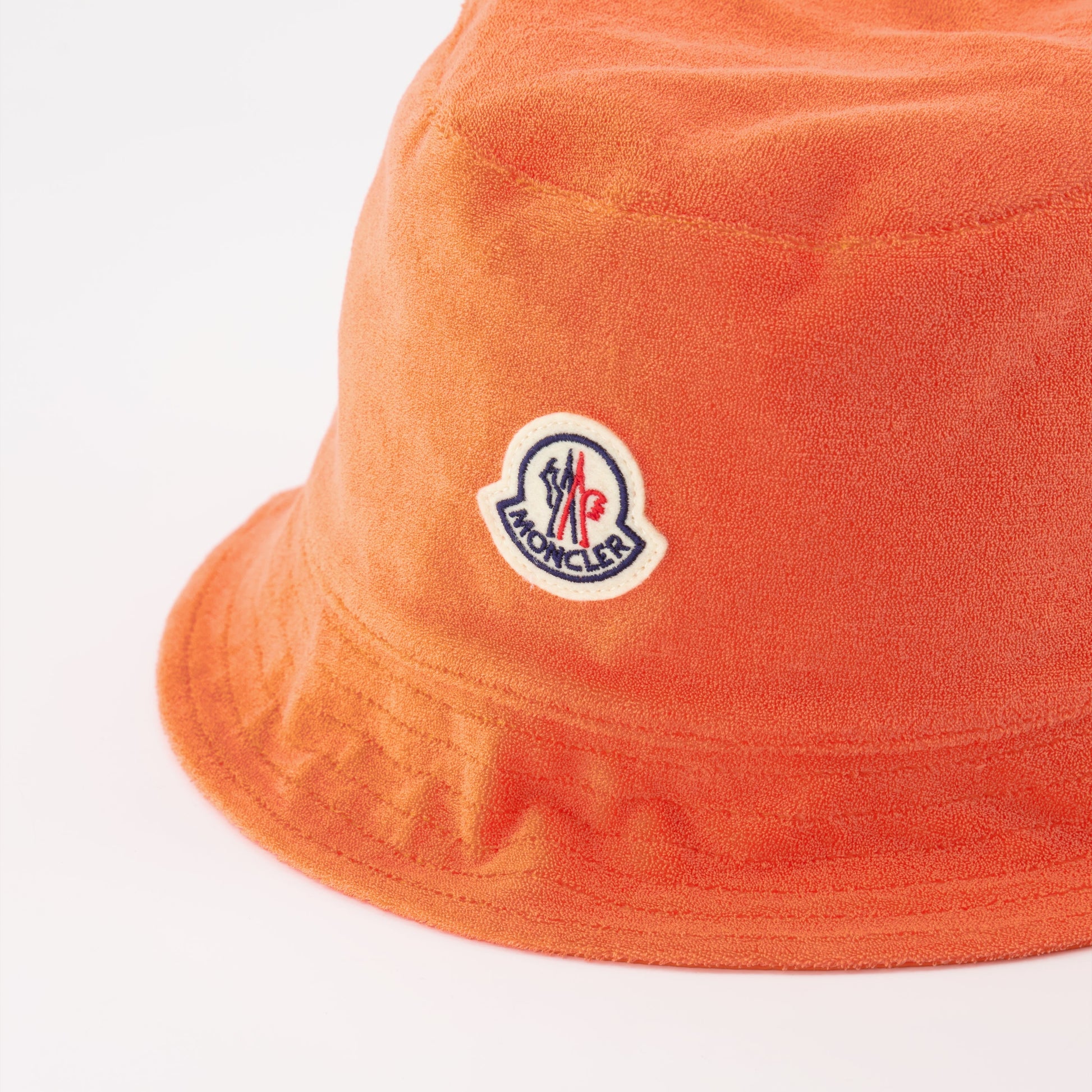 Moncler bucket hat, orange bucket hat, women's luxury hats, designer accessory, Moncler logo hat