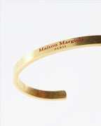Maison Margiela, gold cuff bracelet, luxury jewelry, women's bracelet, elegant accessory